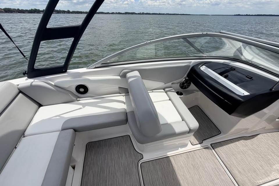 2019 Regal 1900 ES Bowrider interior with seating and dashboard, on a calm lake.
