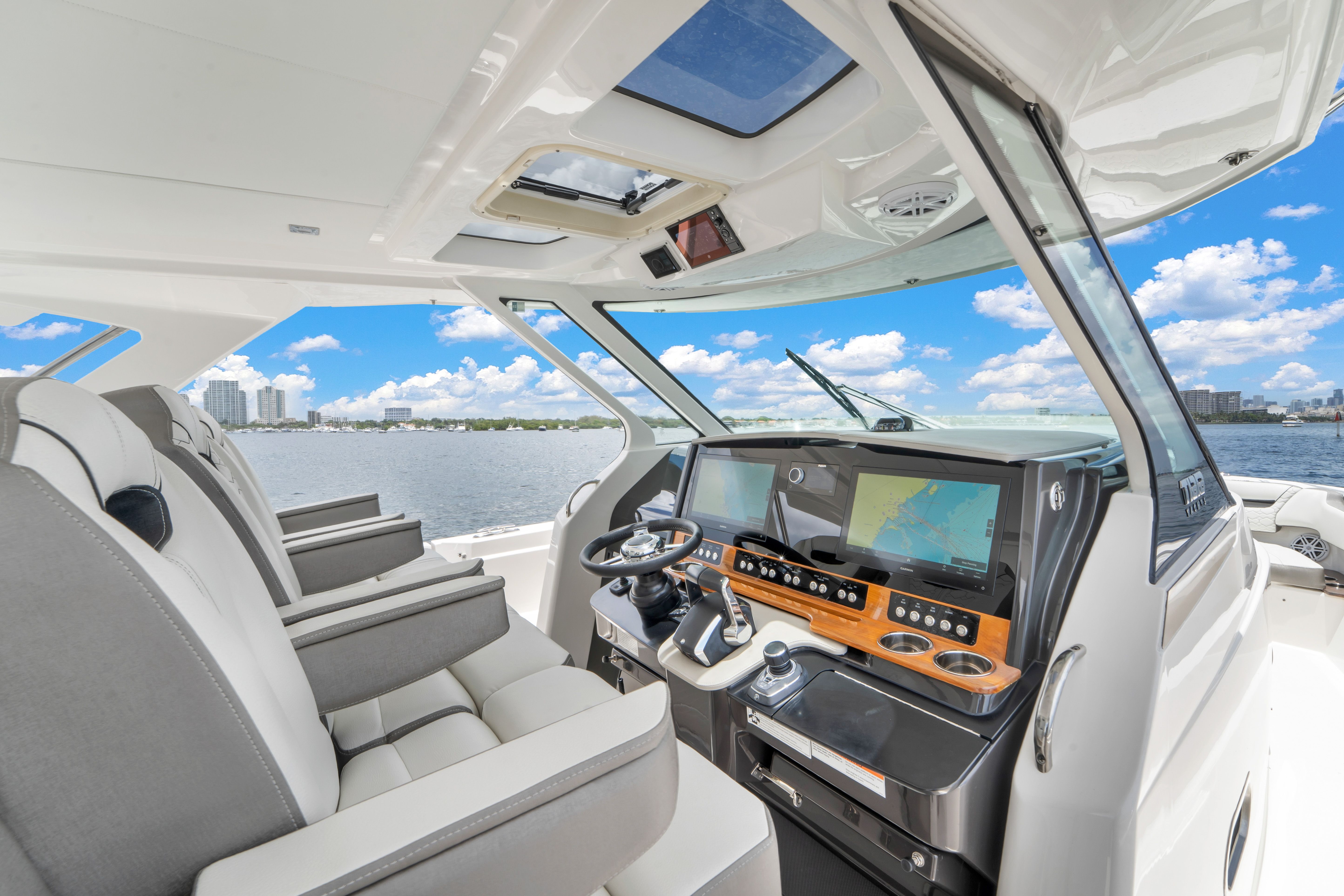 Interior view of the Tiara Yachts 38 LS with a modern helm and panoramic water view.