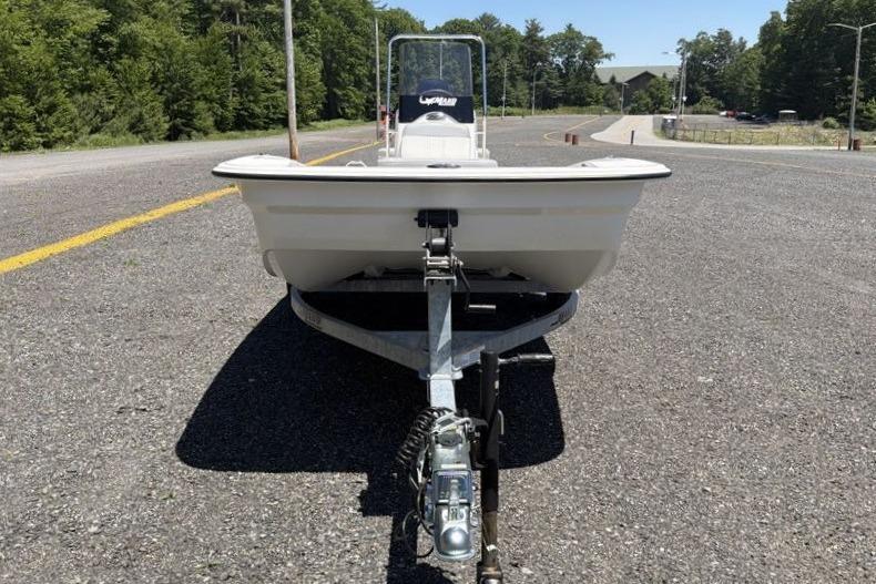 Front view of a 2026 Mako Pro Skiff 15 CC boat on a trailer.