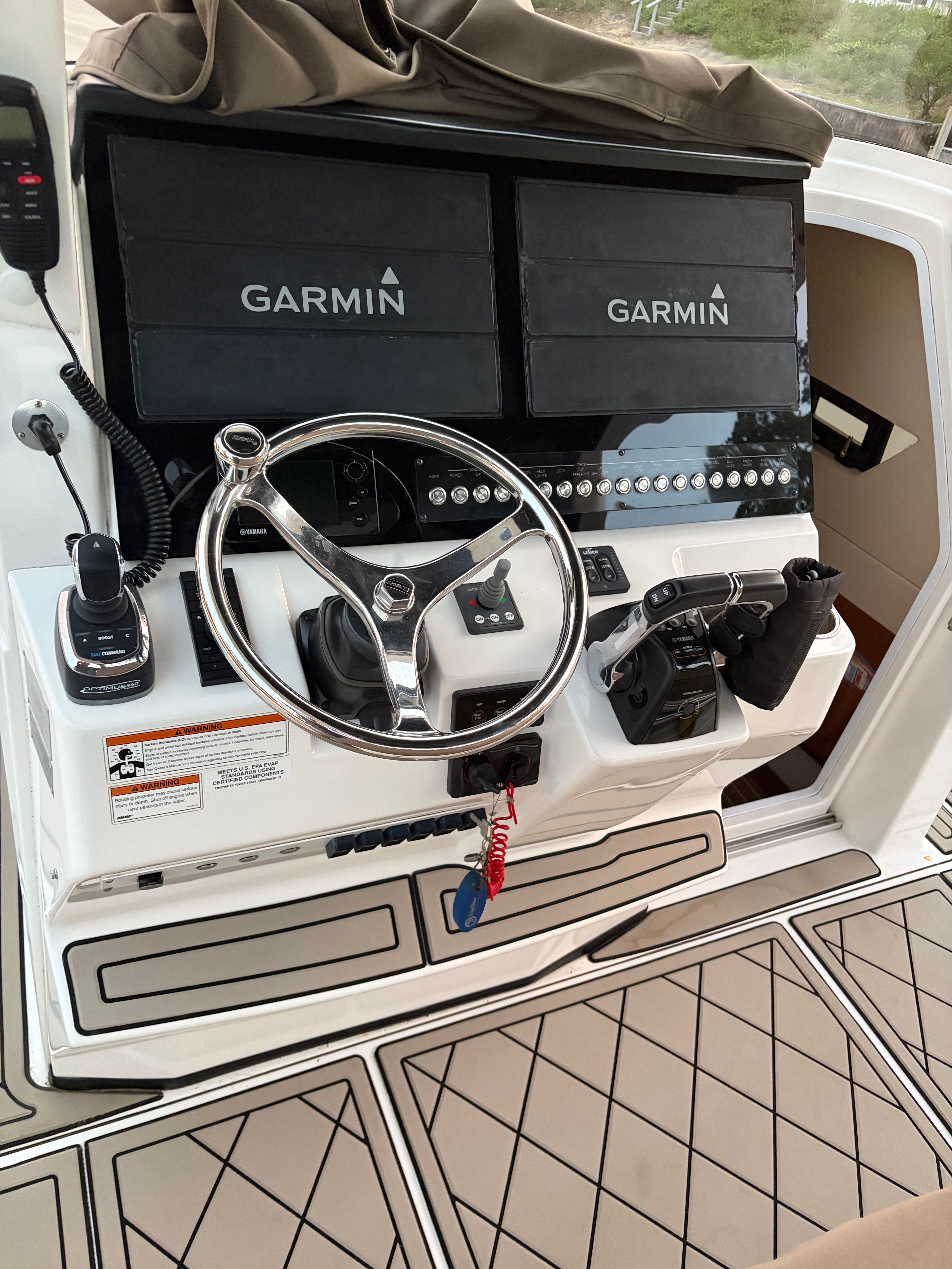 Edgewater 370CC boat helm with Garmin displays.