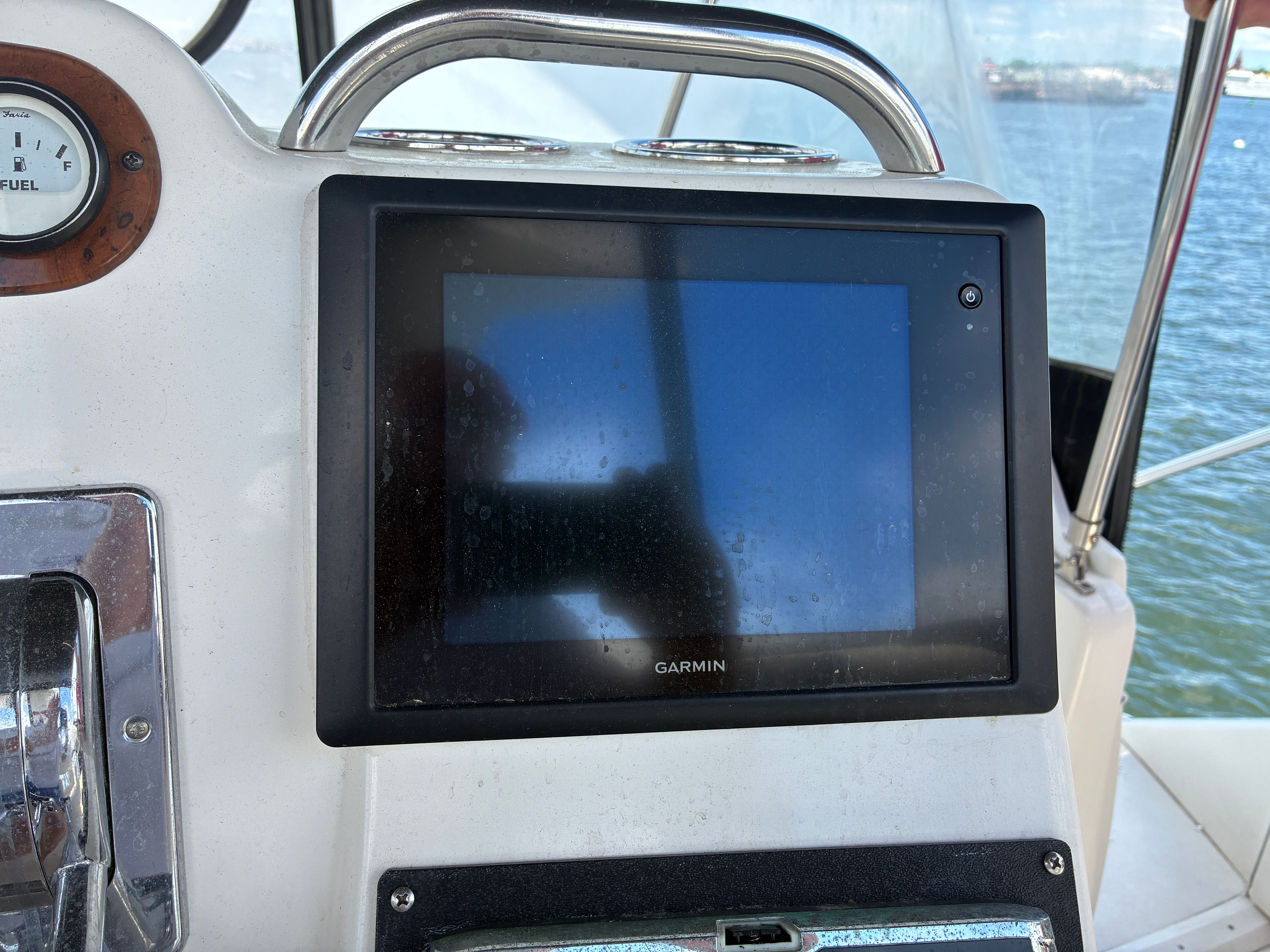A Garmin navigation system is mounted on the helm of a 2001 Silverton 392 Motor Yacht.