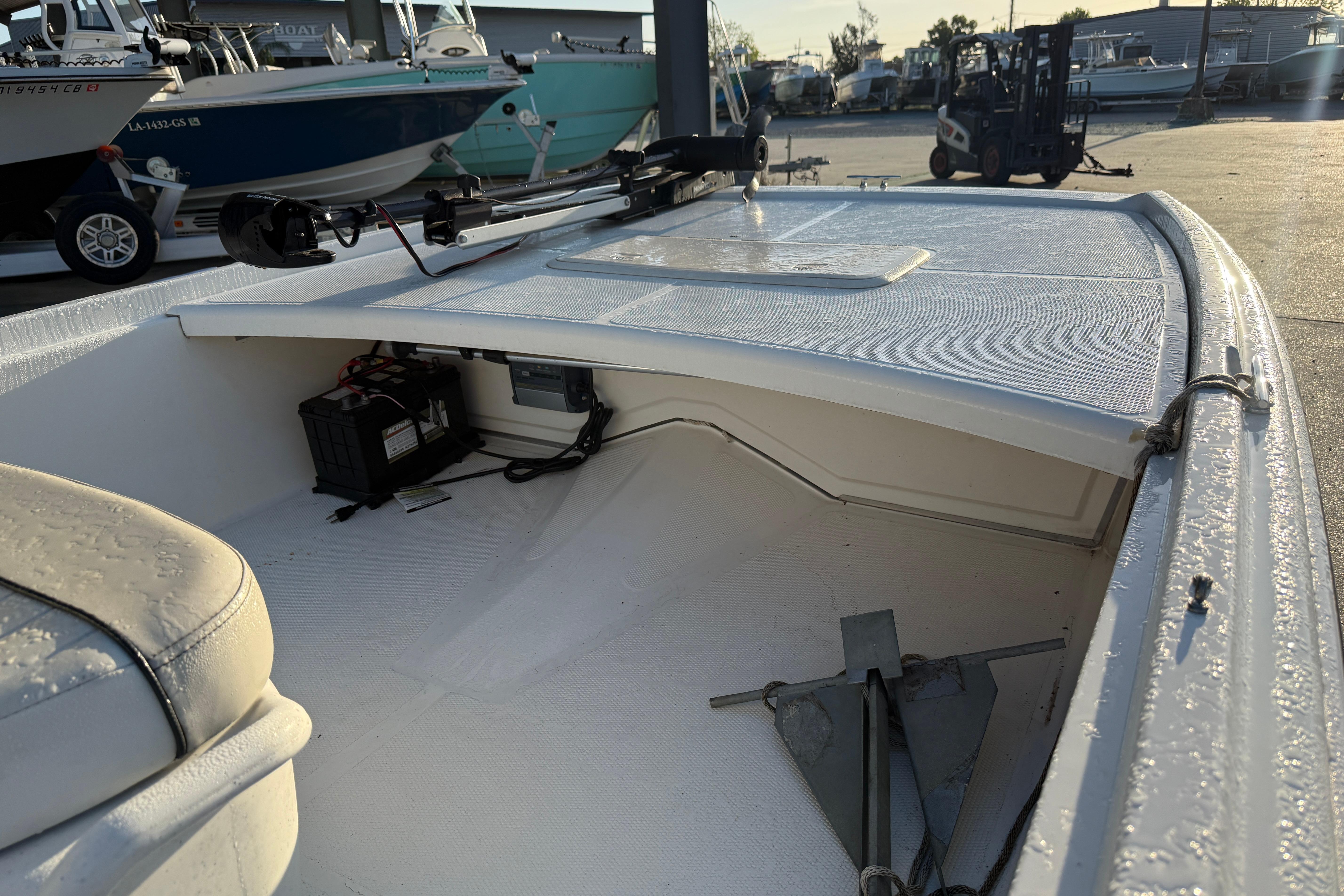 2017 Mako Pro Skiff 17 CC boat interior with anchor and battery storage.
