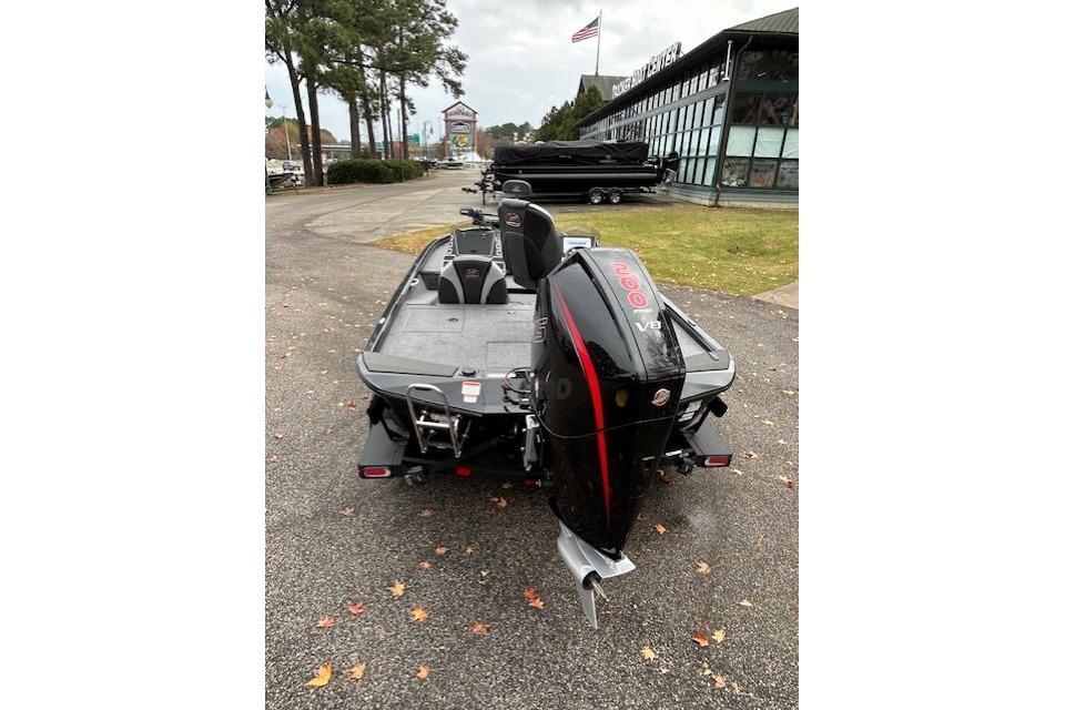 2025 Ranger ALPHA 208 boat with powerful V8 engine, parked outdoors near dealership.