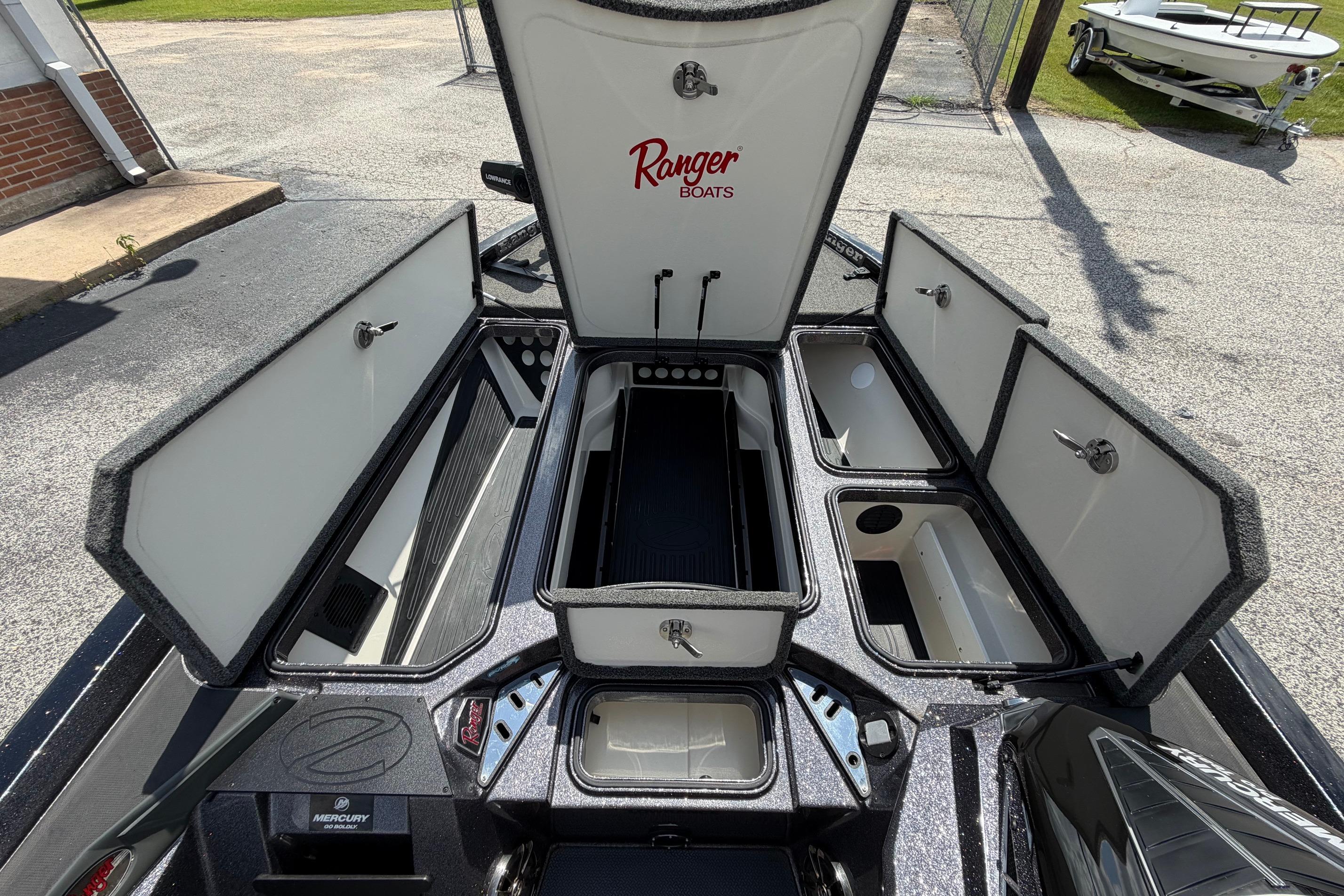 2020 Ranger Z520L boat with open storage compartments and visible Mercury engine.