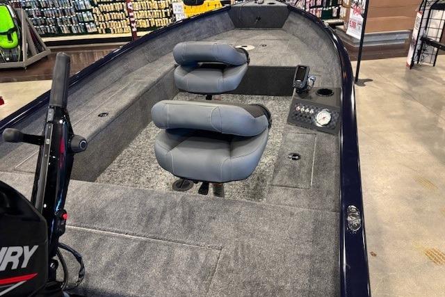 2026 Tracker Super Guide V-16 T boat interior with gray seating and control panel.