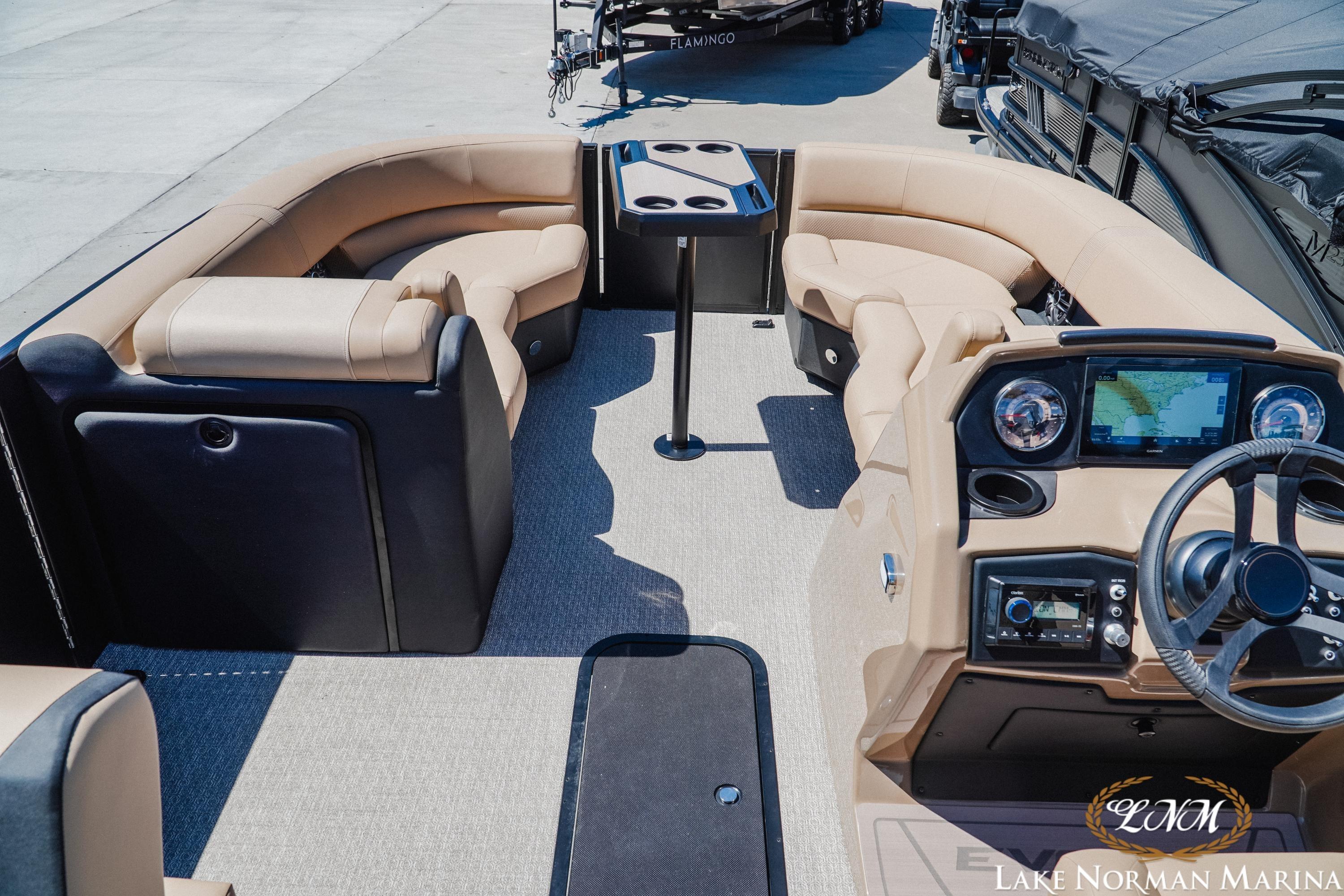 Luxurious 2026 Evotti 523CS boat interior with plush seating and modern dashboard at Lake Norman Marina.