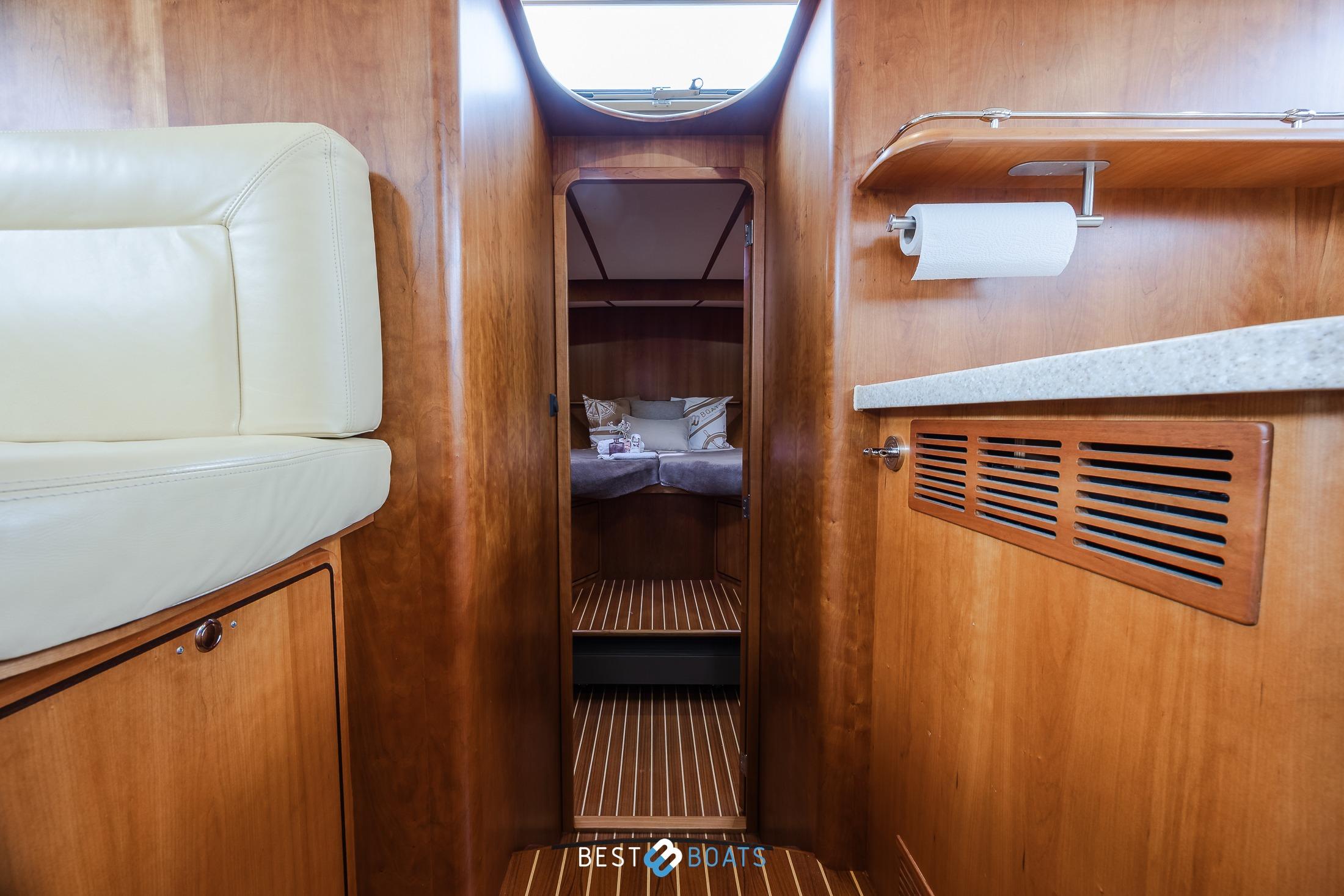 Interior of 2010 Linssen Grand Sturdy 470 AC Mark II Twin yacht, featuring cozy cabin and wooden finishes.