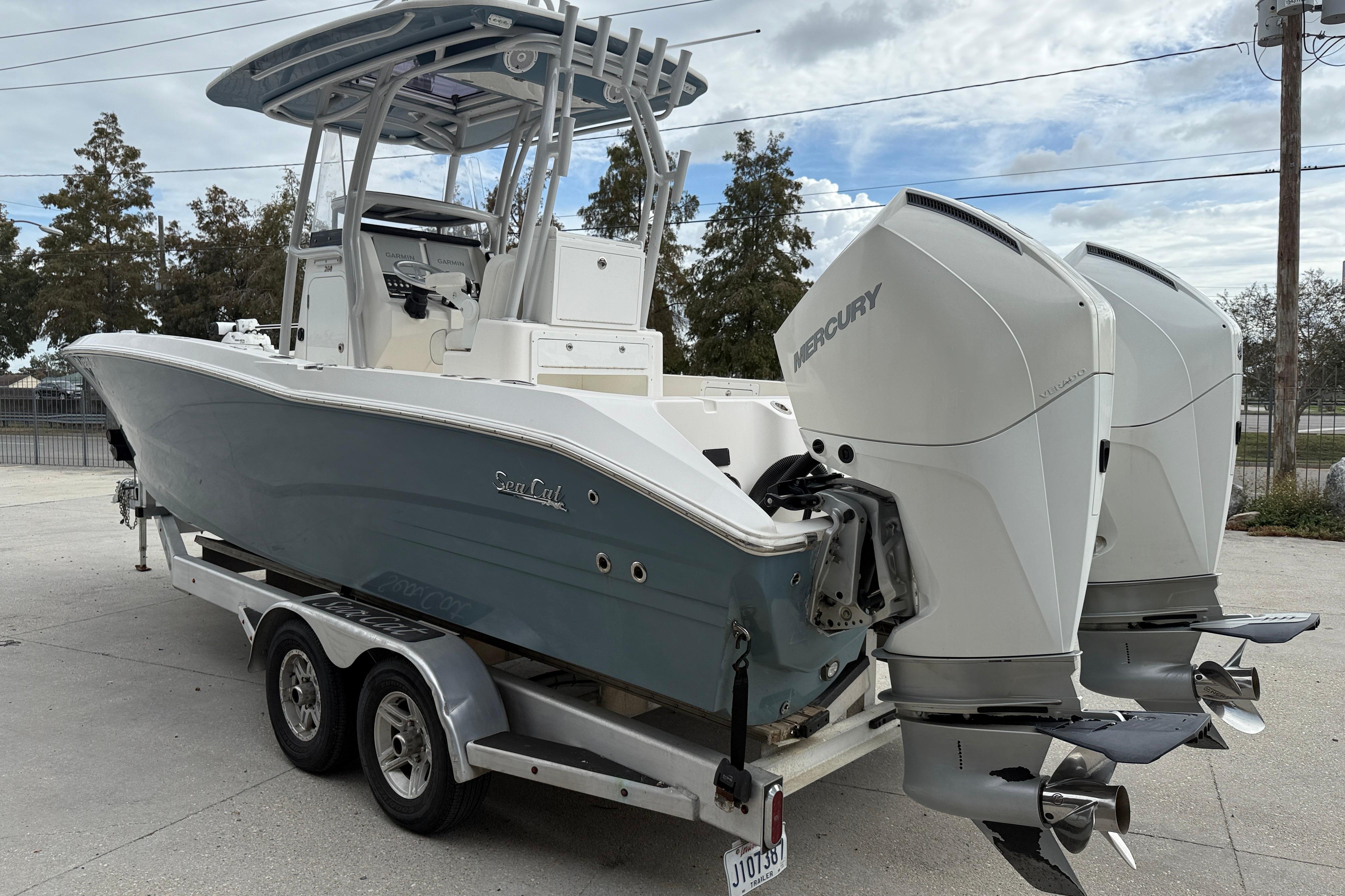 2021 Sea Cat 260 boat with dual Mercury outboard engines on a trailer.