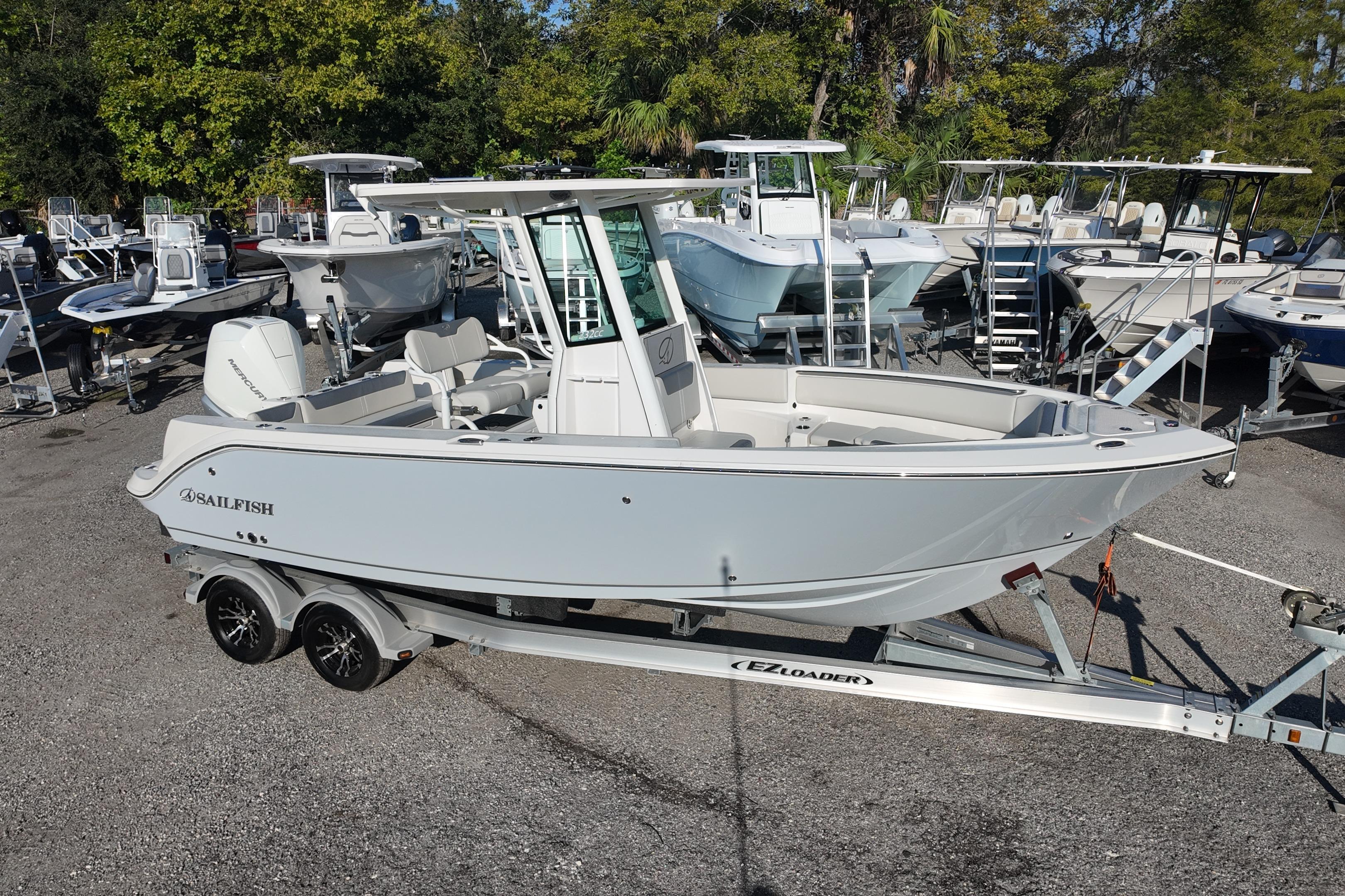 2026 Sailfish 232 CC boat on trailer, surrounded by other boats in a marina.