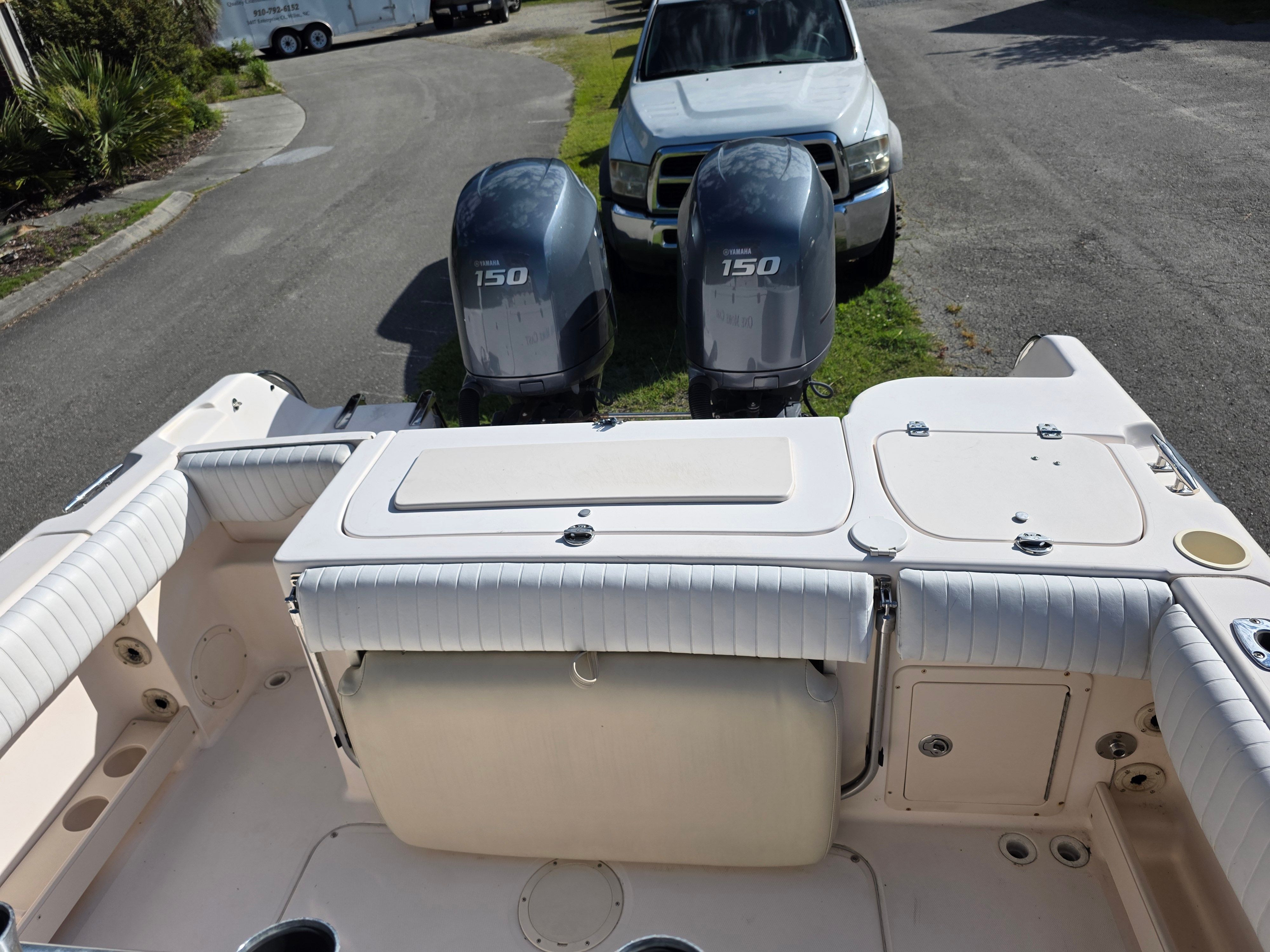 The image shows the stern of a 2006 Grady-White 257 boat with two outboard engines.