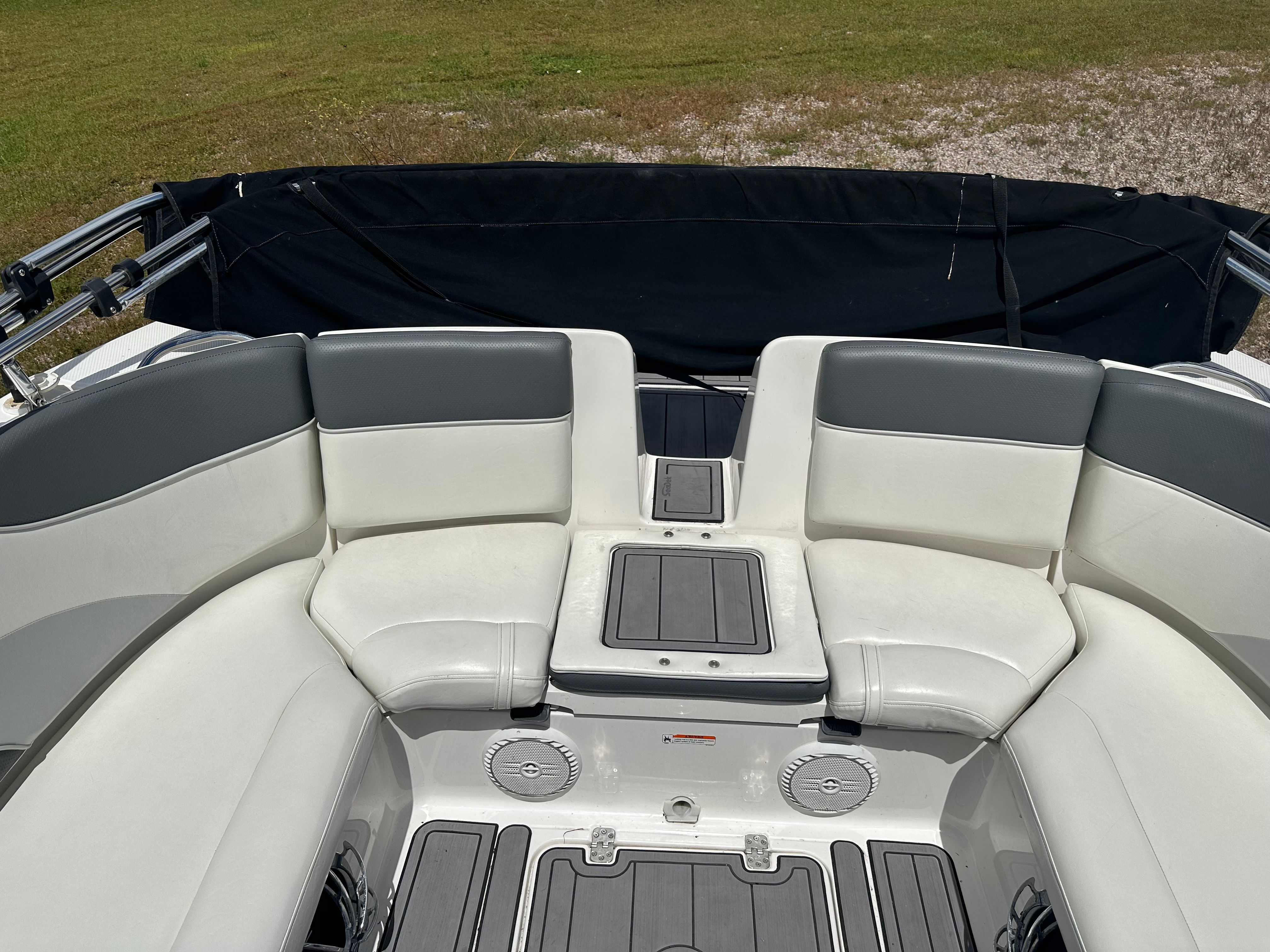 Interior of a 2005 Yamaha AR230 HO boat with gray seating.
