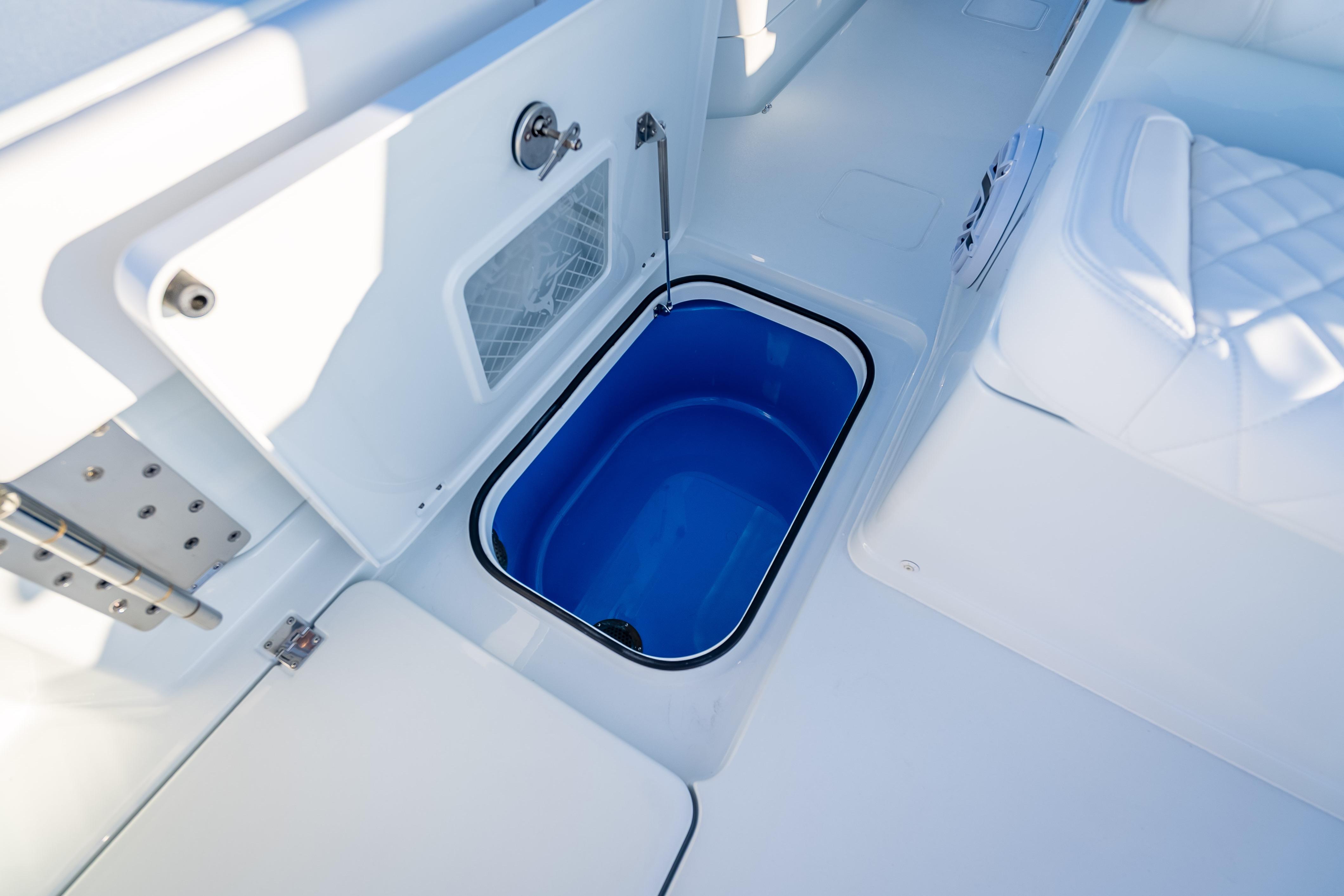 Freeman 35 boat interior, 2026 model, featuring a blue storage compartment.