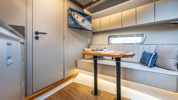 Luxurious interior of 2025 Hanover 415 yacht with modern seating and elegant decor.
