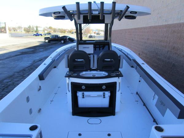 2025 Sea Pro 292 Offshore boat interior with seating and console.