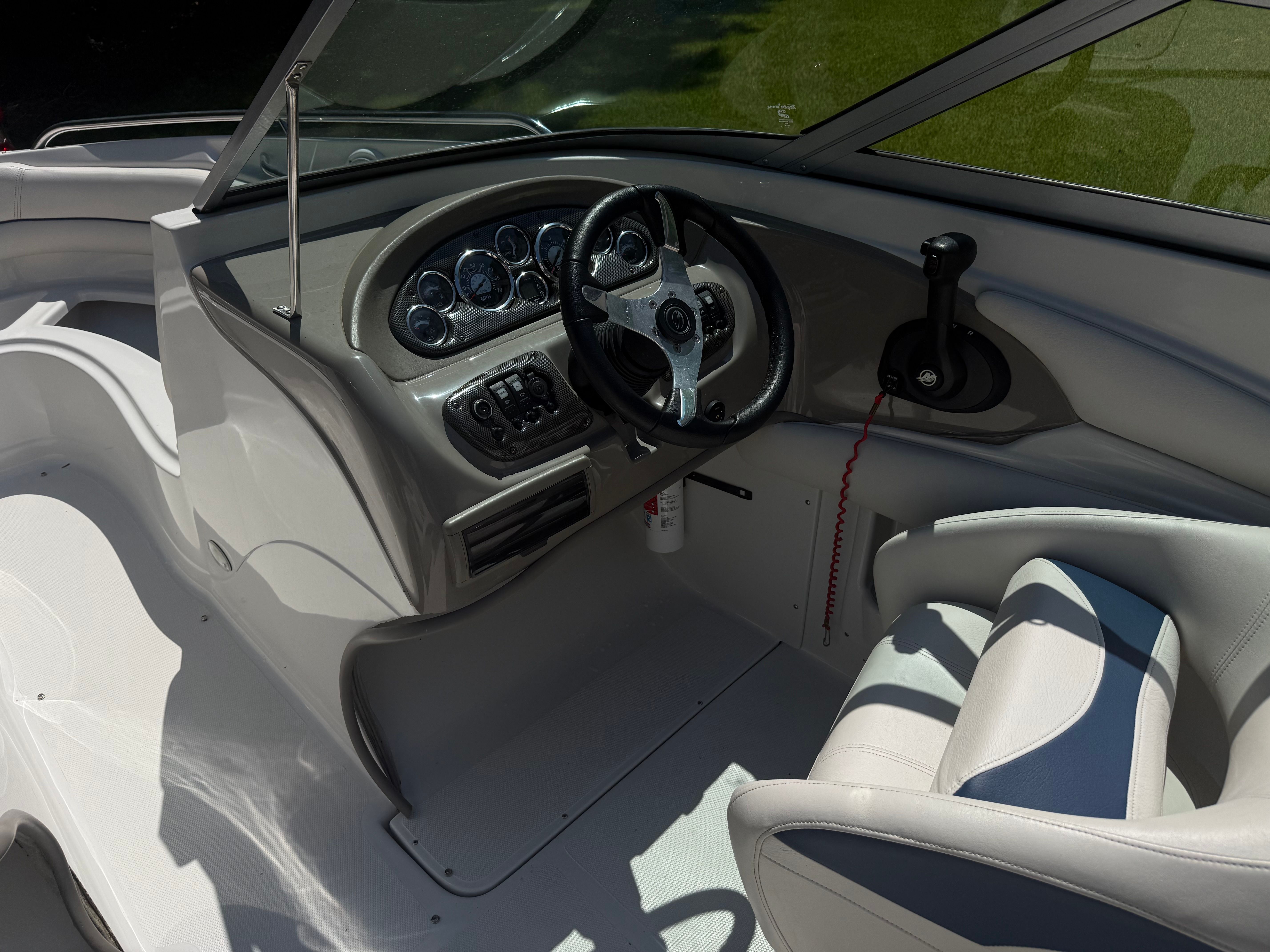 Interior of a 2008 Crownline 210 LX boat with steering console.