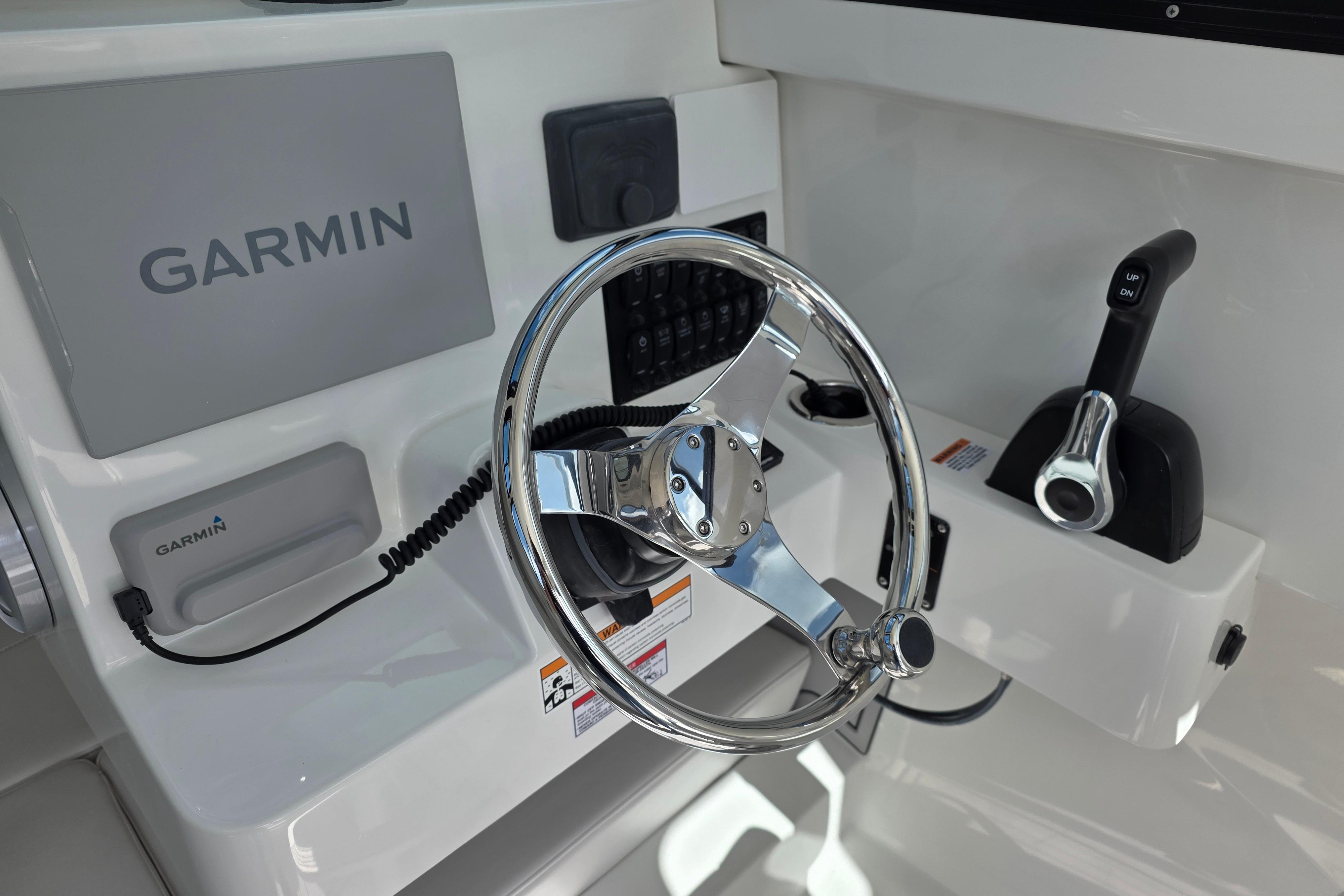 Steering console of 2026 Parker 227 Explorer boat with Garmin navigation system.