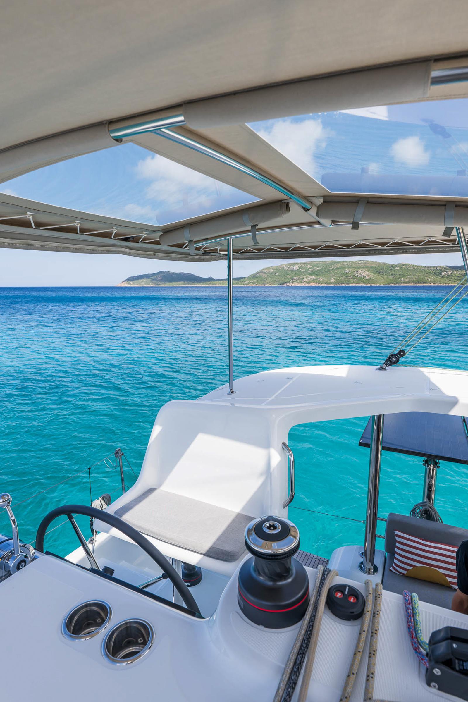 Modern Lagoon 38 catamaran cockpit with ocean view, 2025 model.