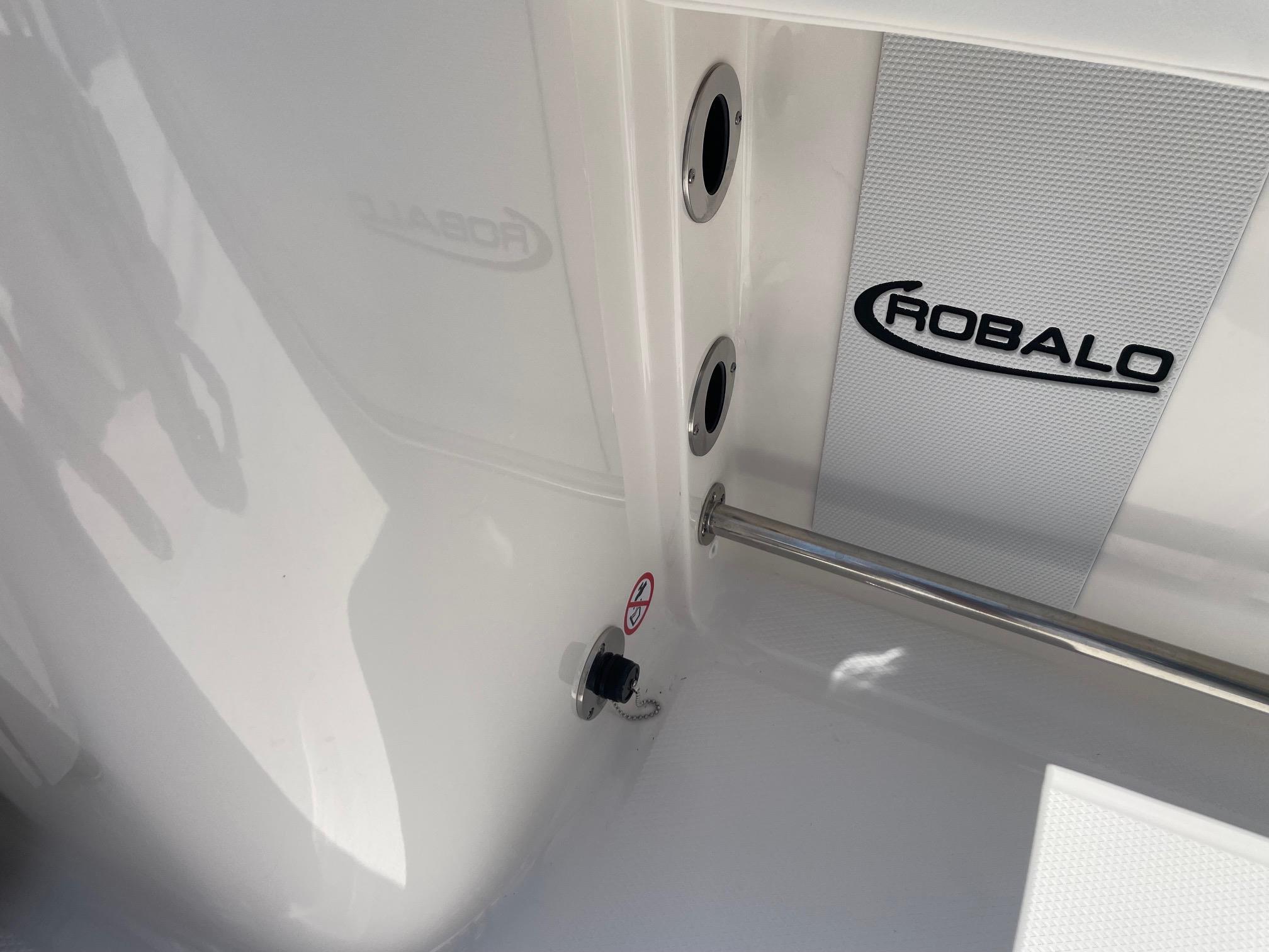 2025 Robalo R230 Center Console interior detail with logo and fittings.