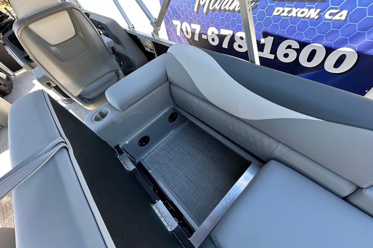 2026 Tahoe Pontoon LTZ Quad Lounger Shift 23 interior seating with storage compartment.