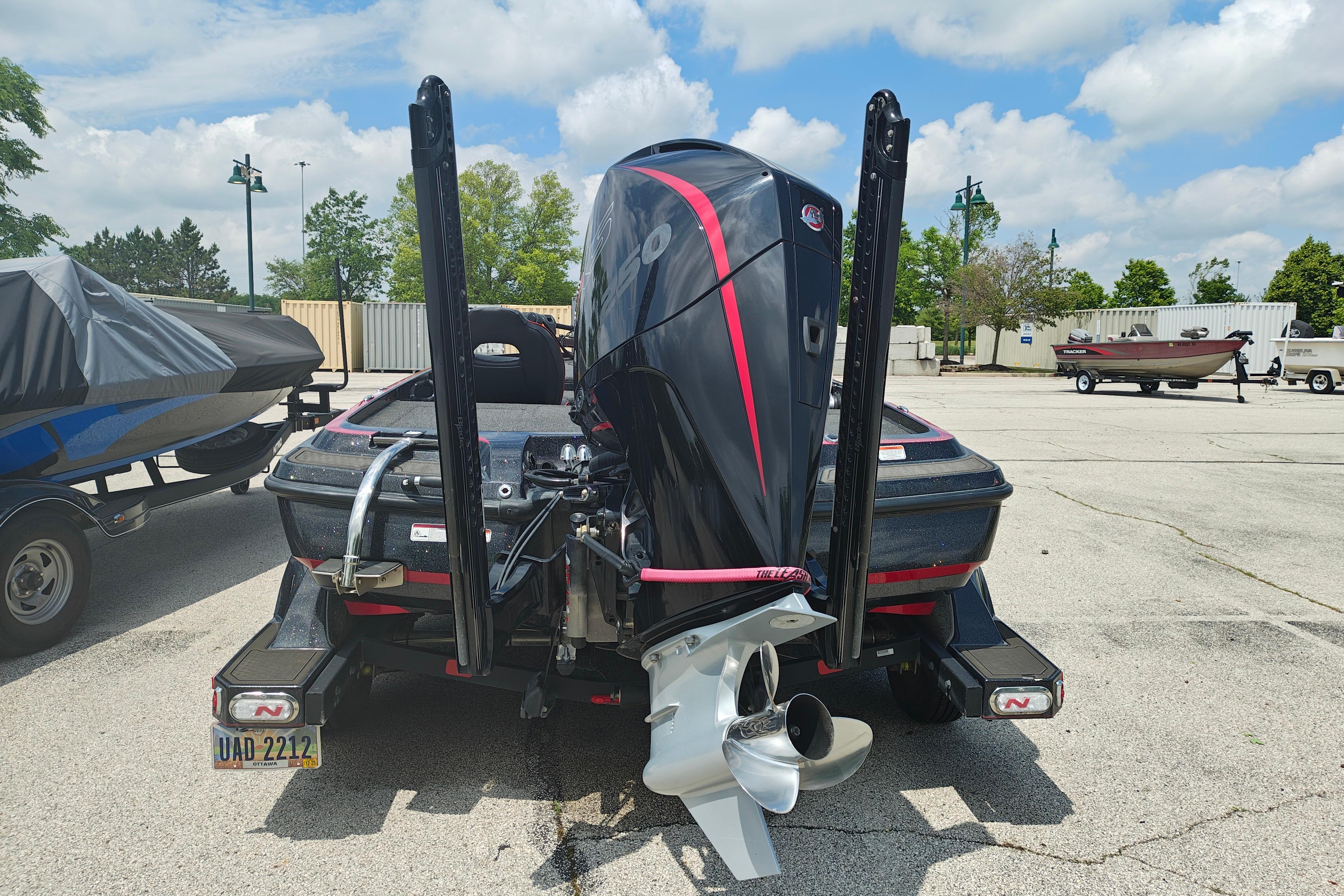 2022 Nitro Z21 XL Pro boat with powerful outboard motor in a parking lot.