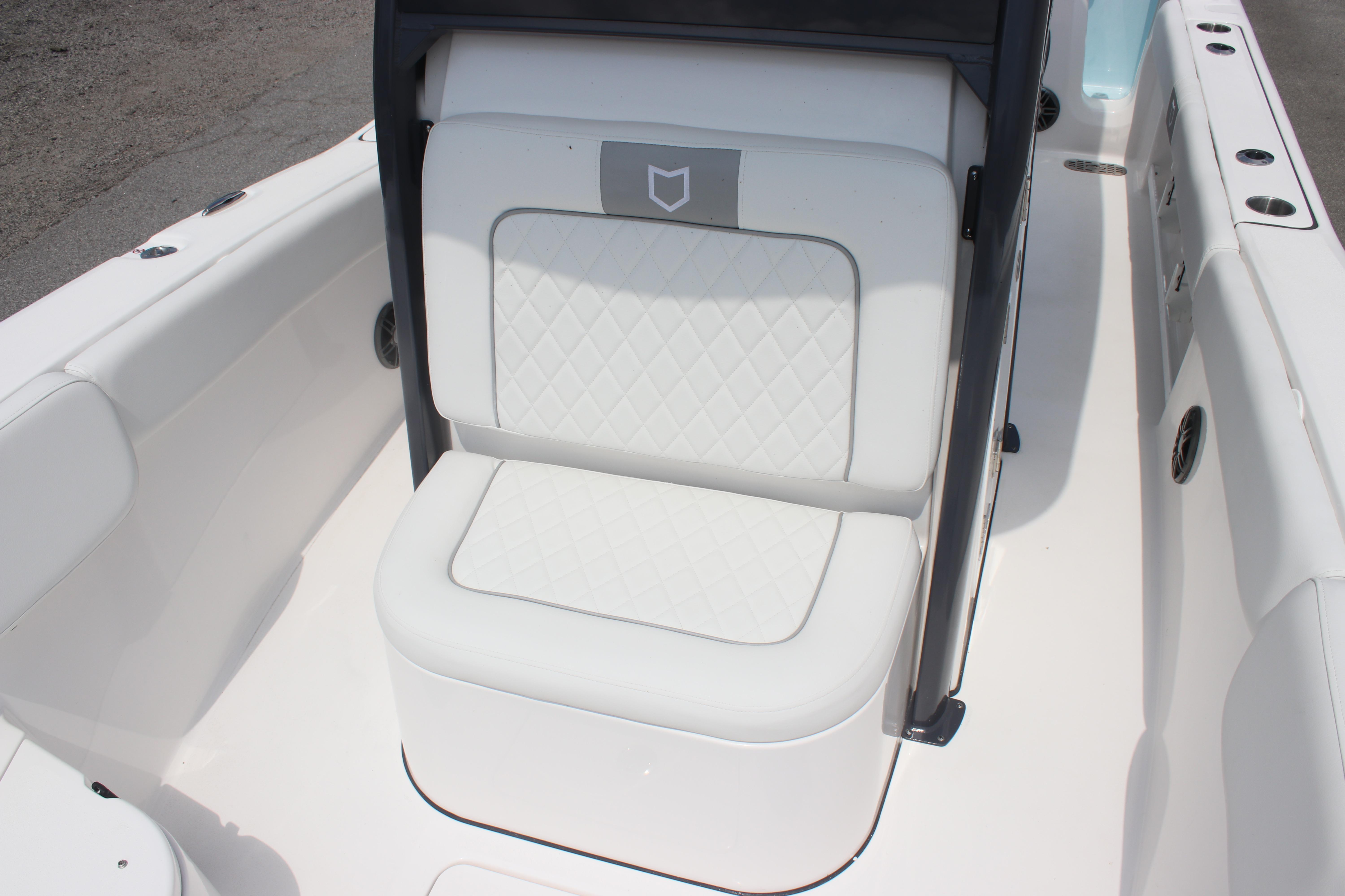 2026 Sea Fox 248 Commander boat seat with quilted white upholstery.