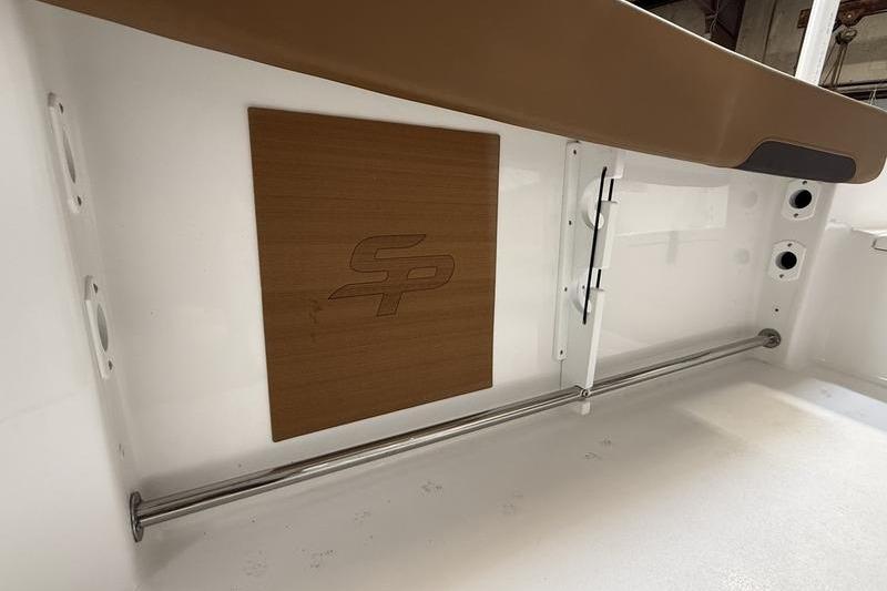 2026 Sea Pro 242 Center Console interior detail with logo and stainless steel rail.