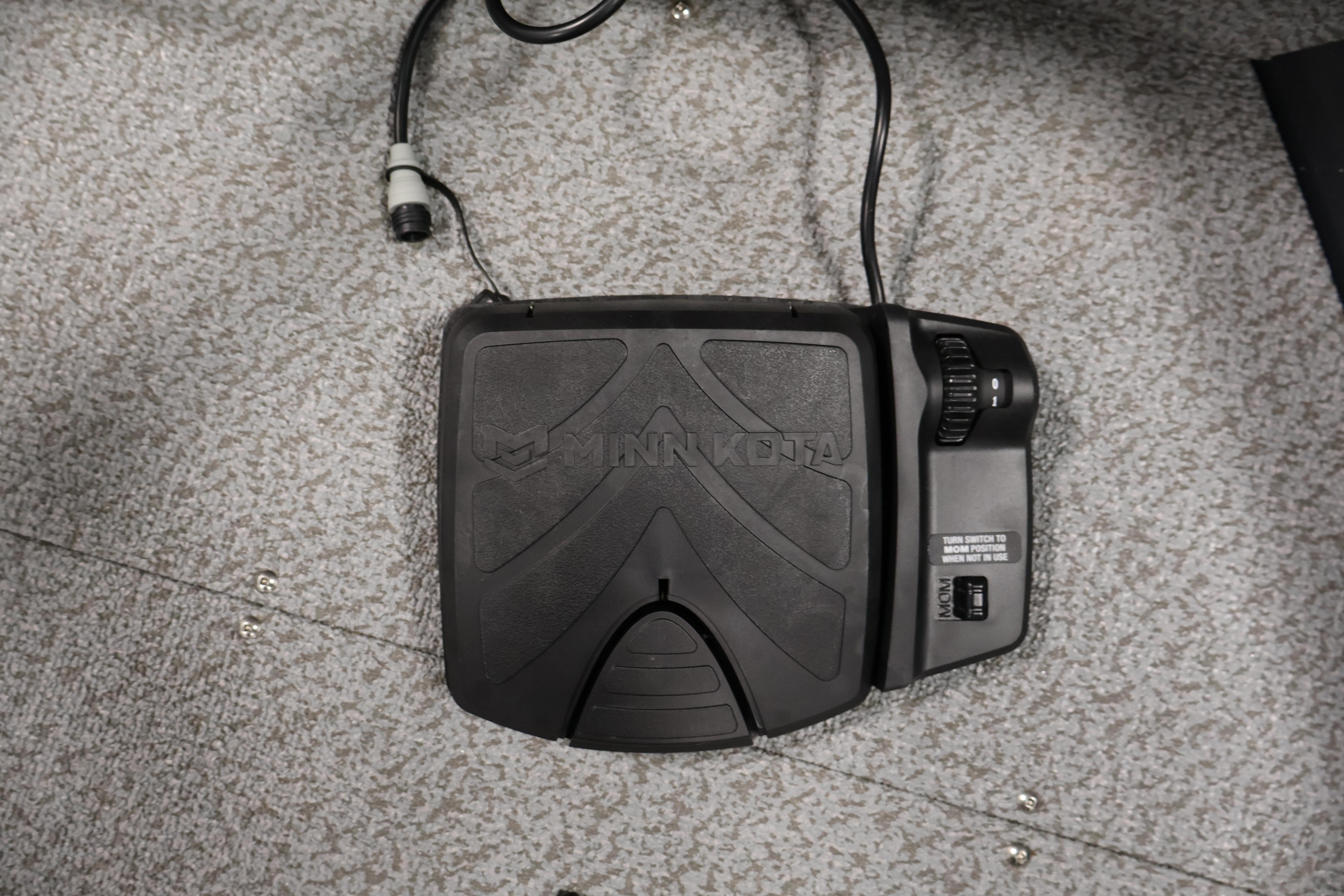 Minn Kota foot pedal on 2026 Crestliner 1850 Kodiak SC boat's carpeted floor.