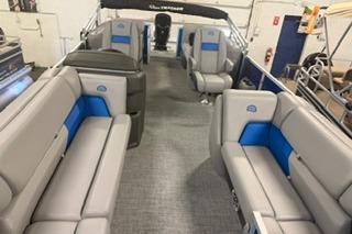 2026 Sun Tracker Party Barge 22 DLX interior with gray and blue seating.