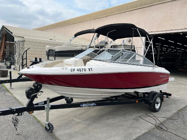 2013 Regal 1900 boat on trailer with red and white exterior.