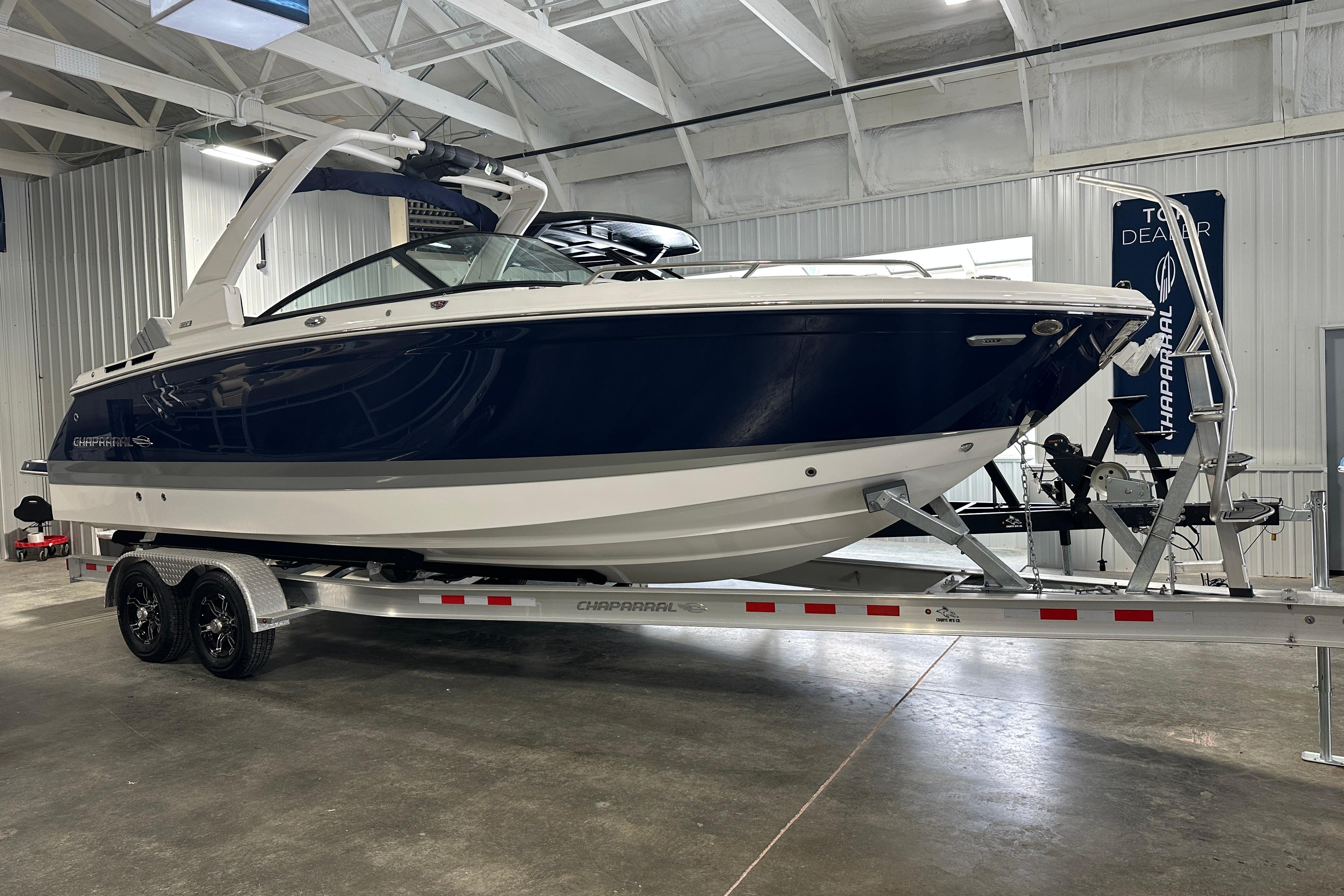 2026 Chaparral SSX 8 boat on trailer in warehouse.
