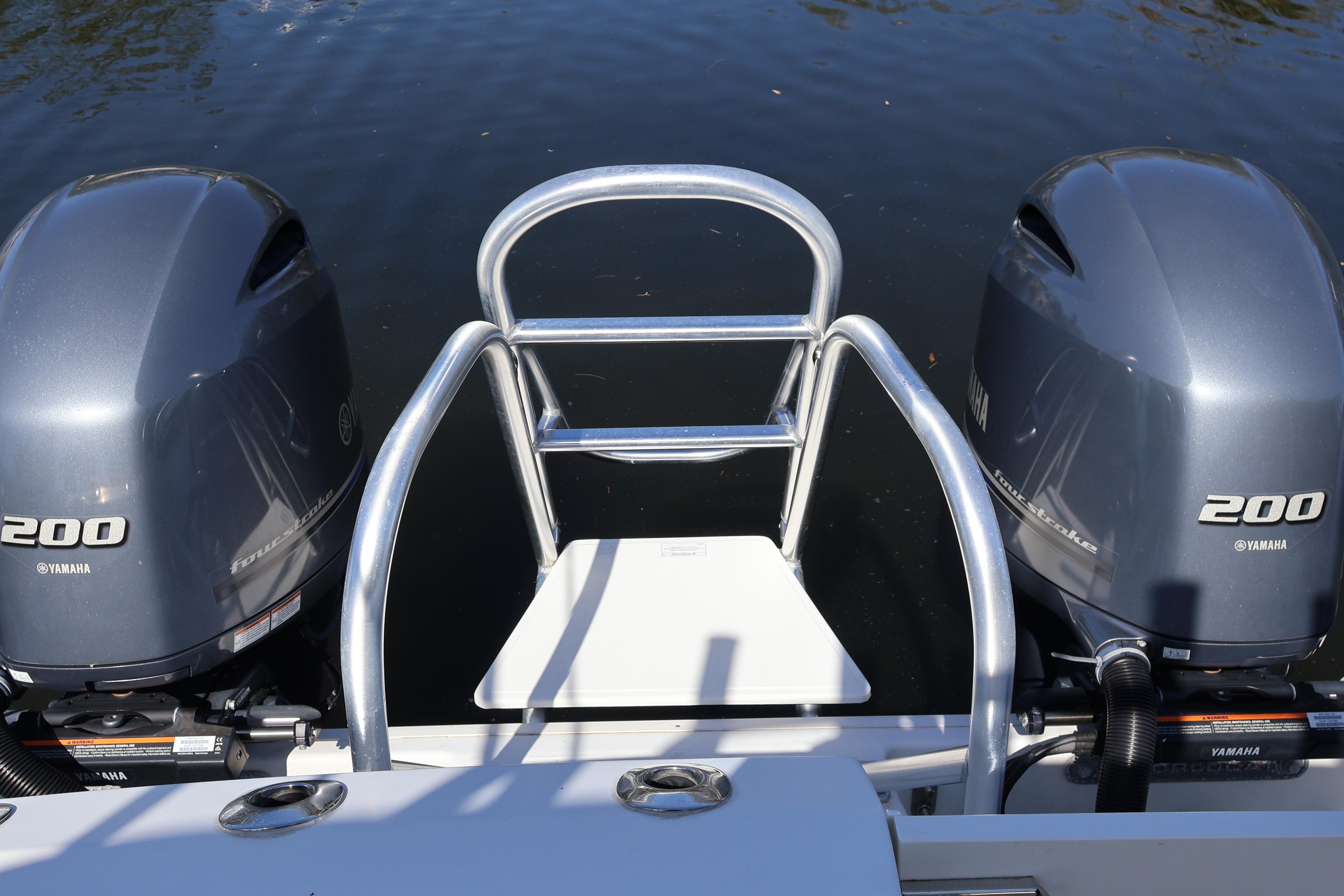 2022 World Cat 280 CC-X boat with dual Yamaha 200 engines on water.
