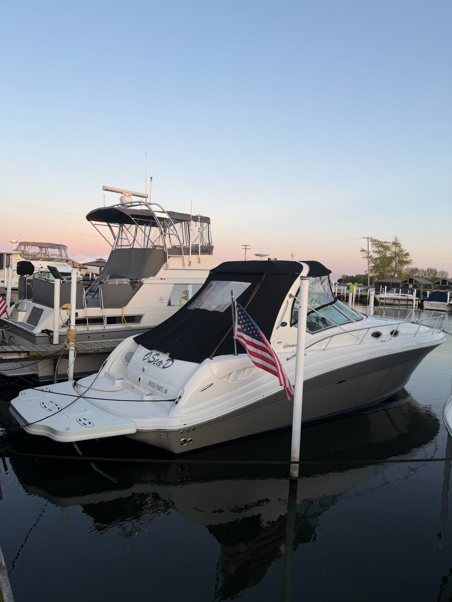 2007 Sea Ray 340 Sundancer docked at sunset.