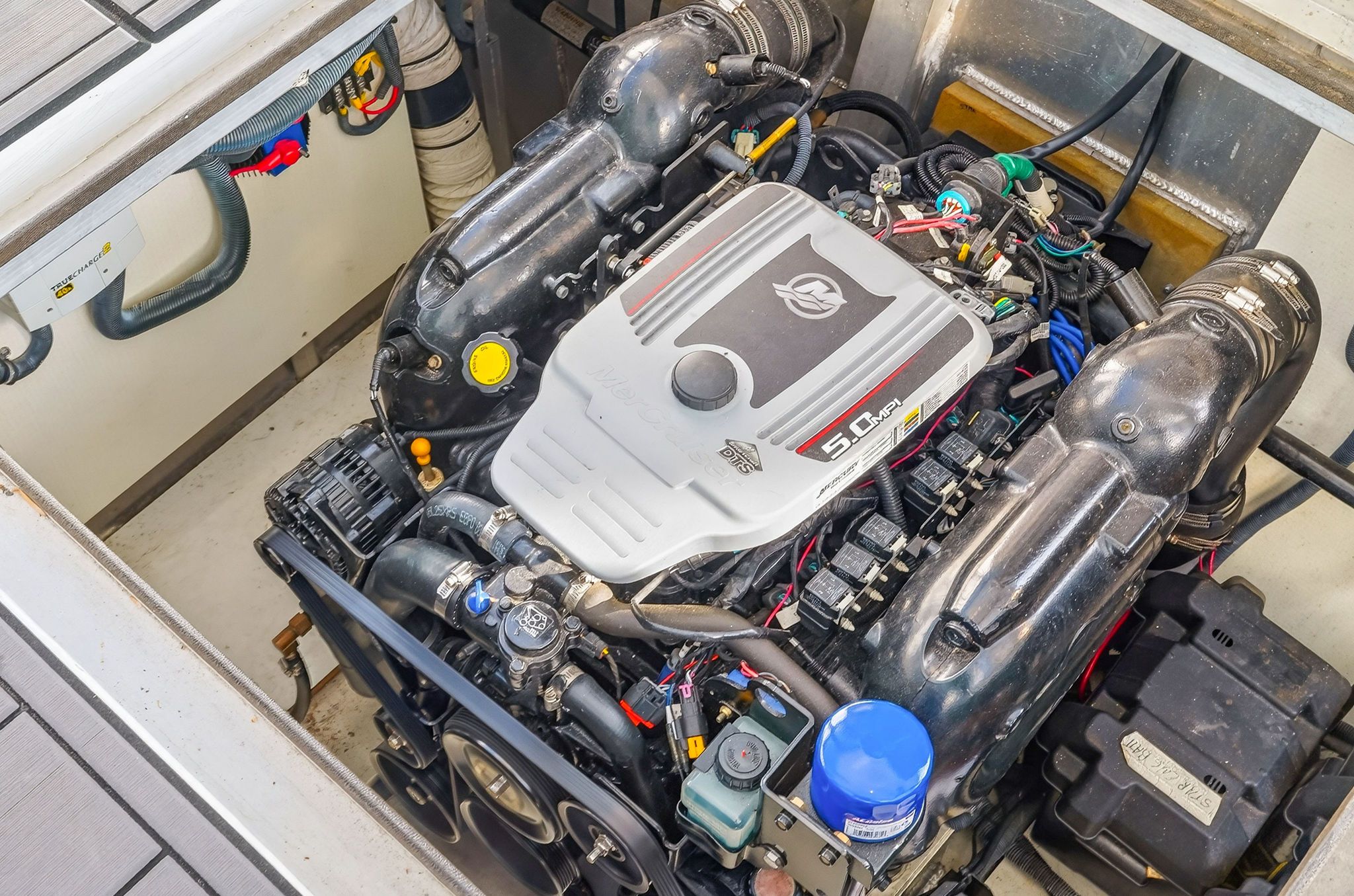 Engine compartment of a 2010 Houseboat Thoroughbred with 5.0 MPI engine.