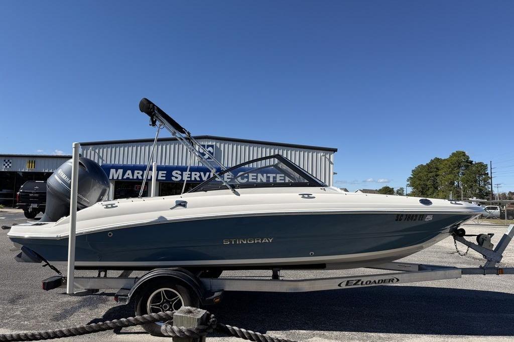 2024 Stingray 191 DC boat on trailer at marine service center.