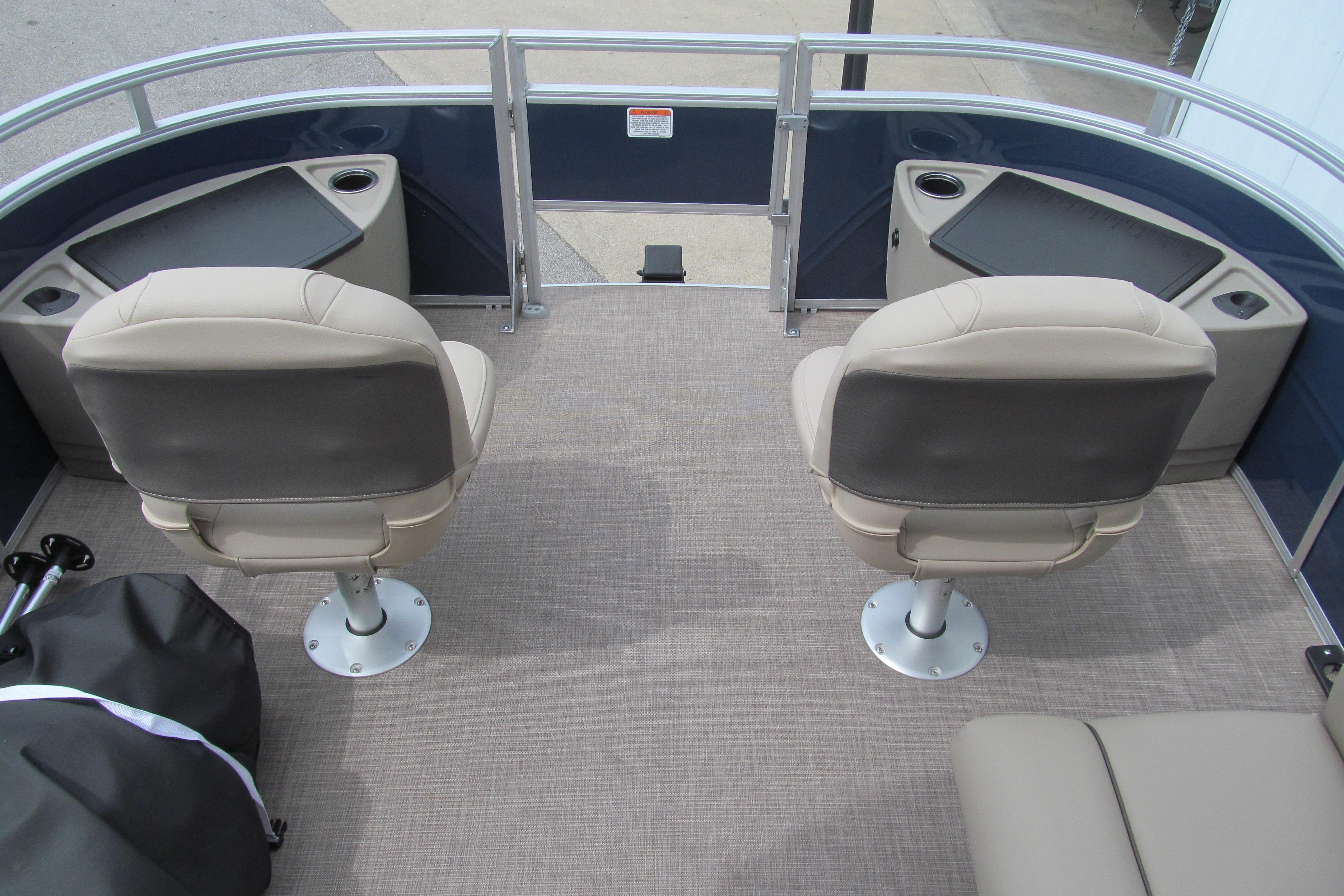 2024 Sun Tracker Fishin' Barge 20 DLX interior with two swivel seats and cup holders.