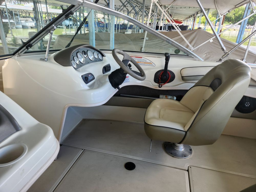 Interior of a 2004 Sea Ray 185 boat with steering console.