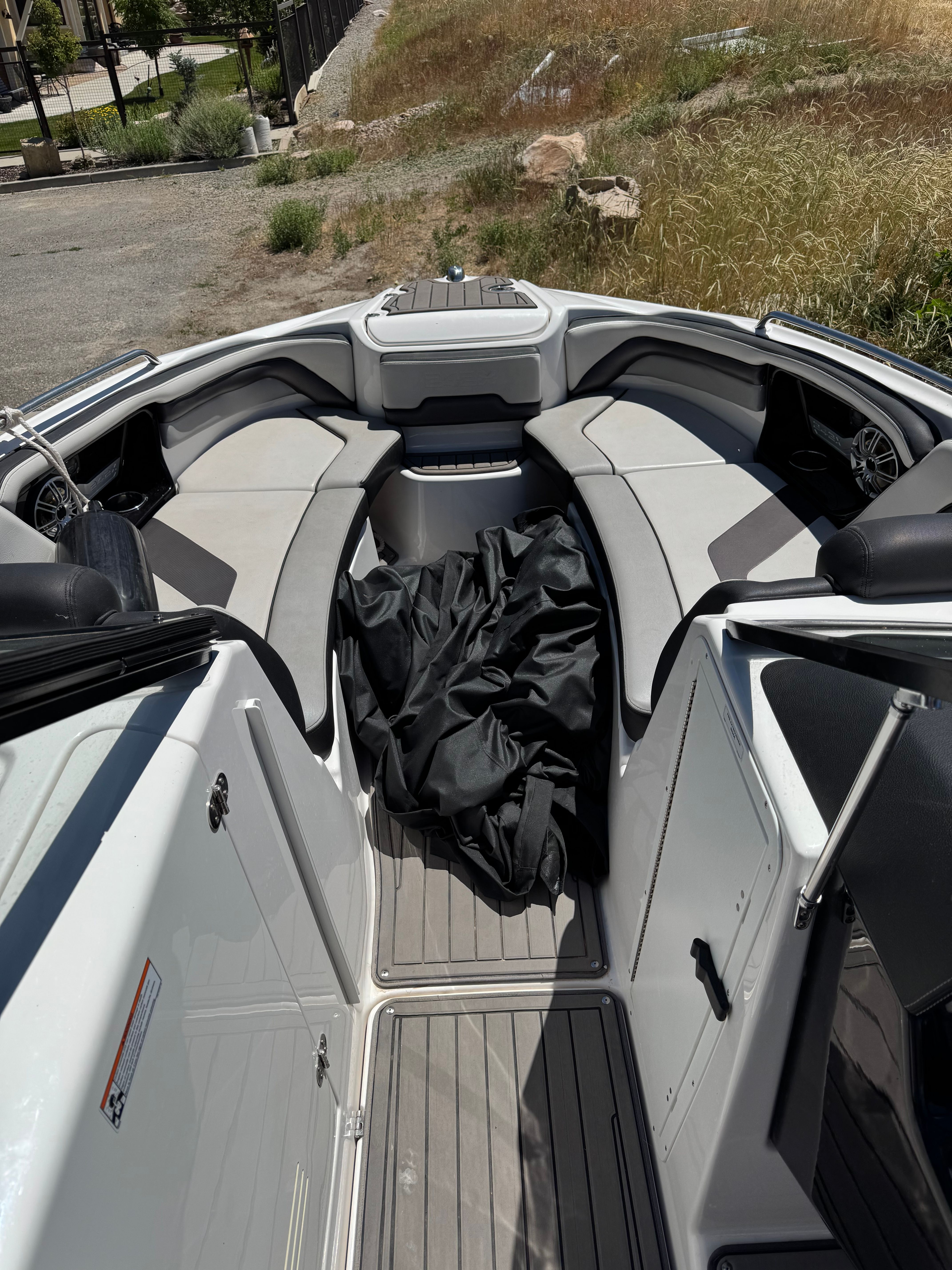 The image shows the cockpit of a 2017 Yamaha 242X E-Series boat with gray seating.