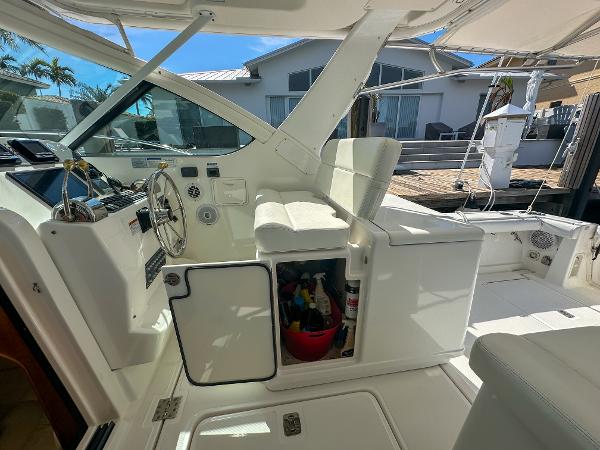 2006 Tiara Yachts 3200 Open cockpit with steering wheel and storage compartment.