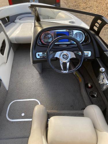 2009 Malibu Wakesetter VTX boat interior with steering wheel and dashboard.