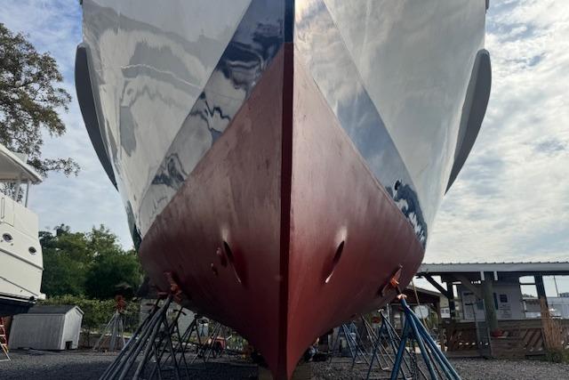 1986 Krogen 42 Classic boat on stands, showcasing its hull and sleek design.