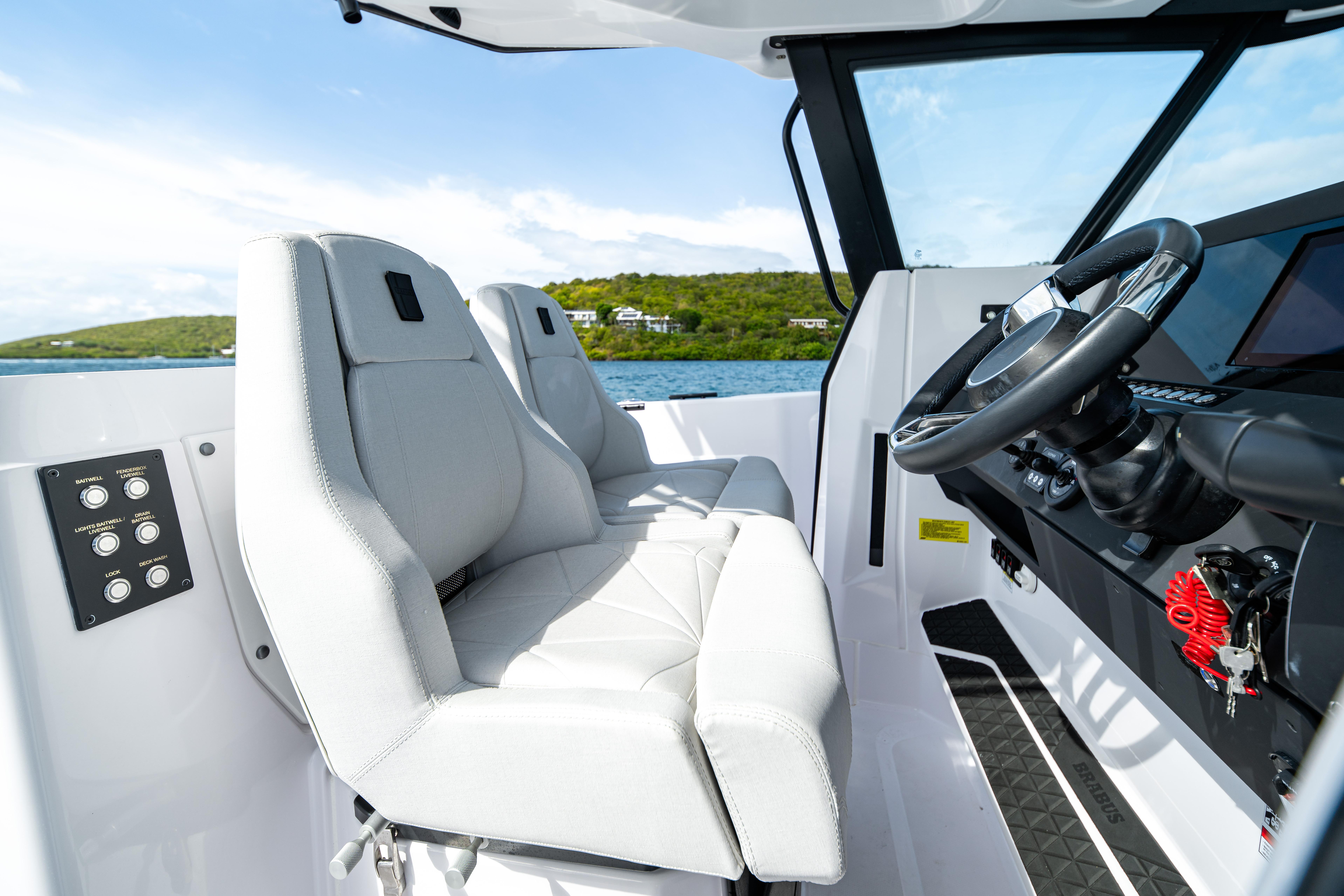 2025 Axopar 29 CCX boat interior with modern steering and comfortable seating.
