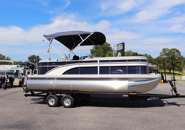 2024 Bennington 21 SSR pontoon boat with canopy on trailer.