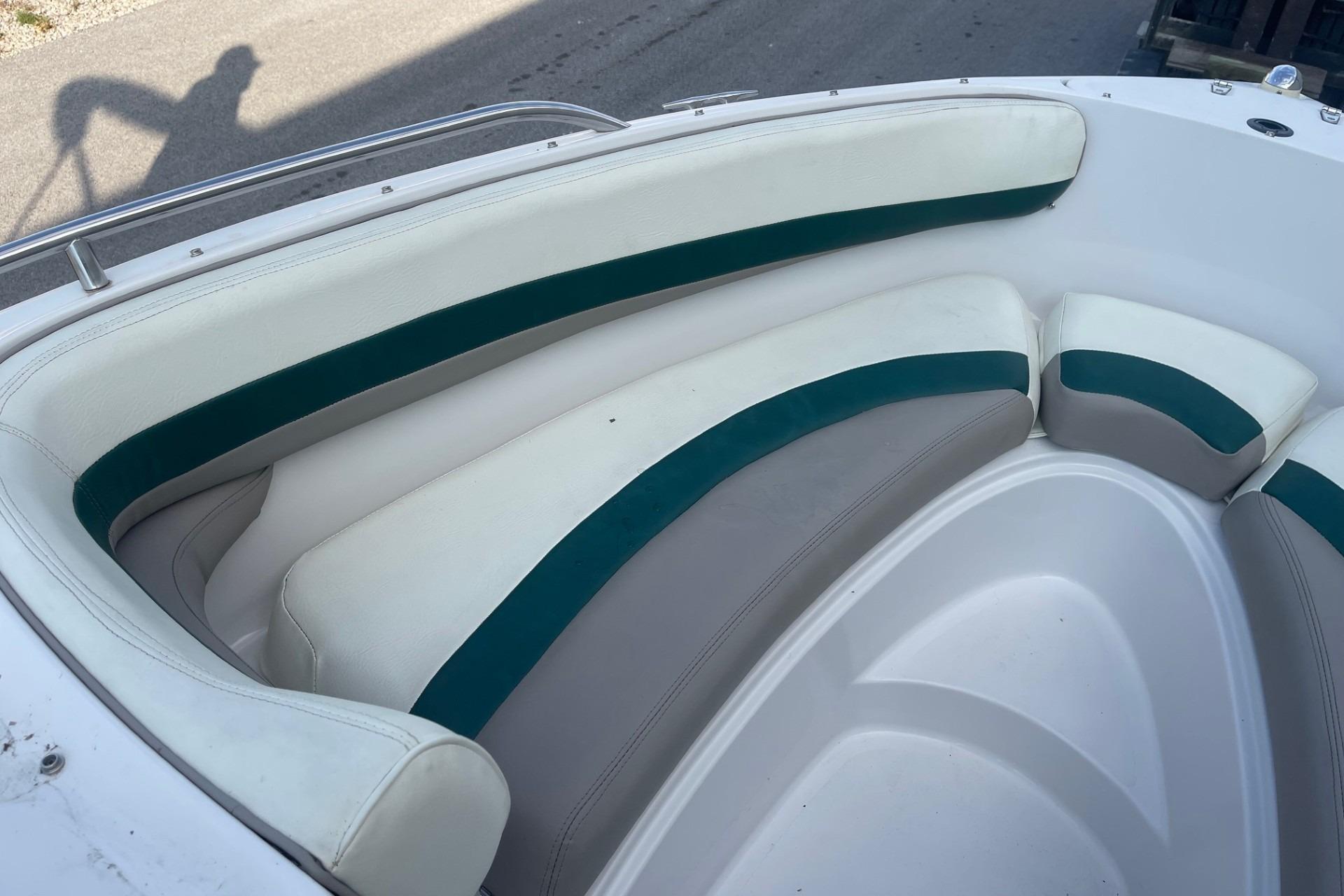 1996 Four Winns 200 Horizon boat interior with white and green seating.