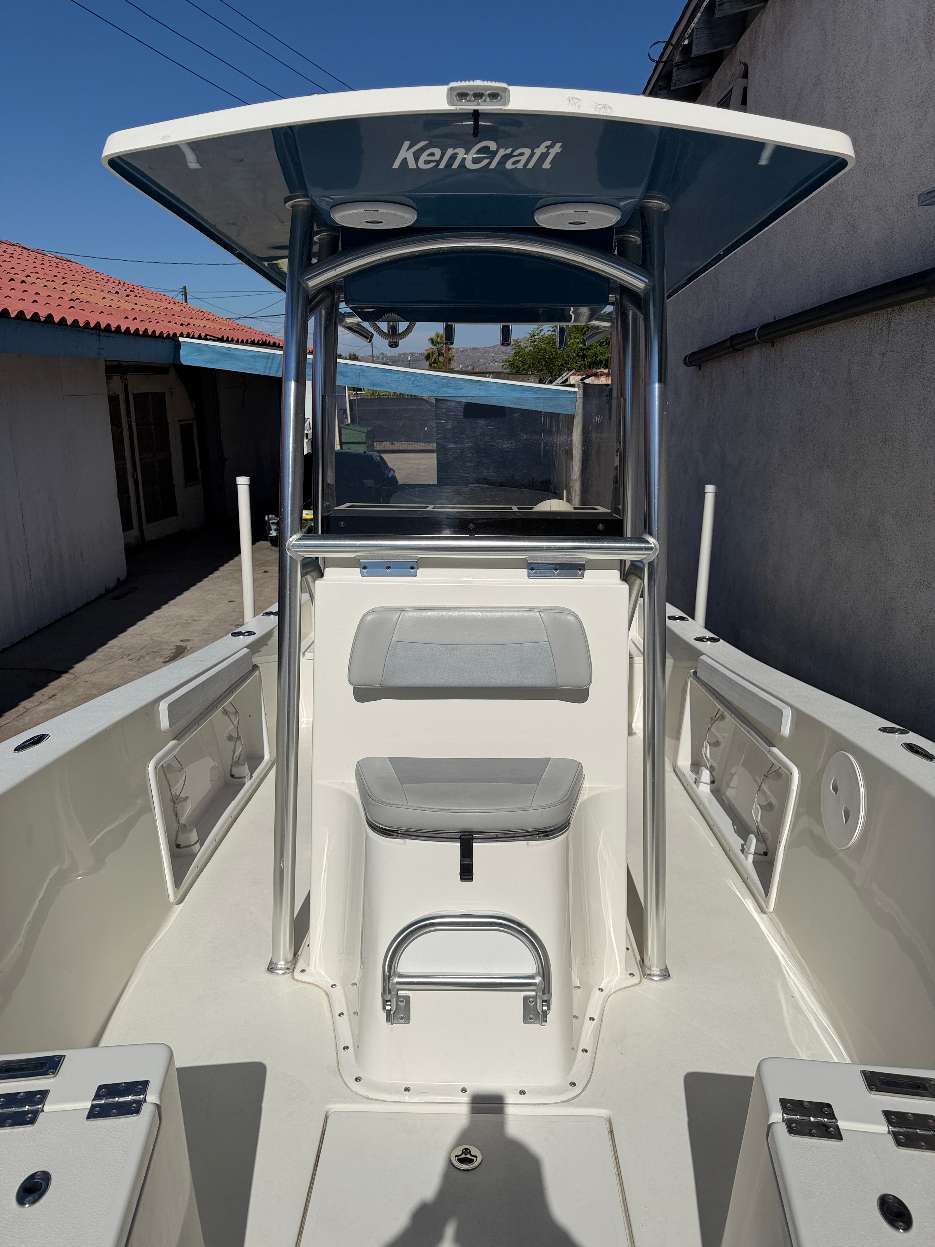 2021 KenCraft Challenger boat with T-top and seating area.