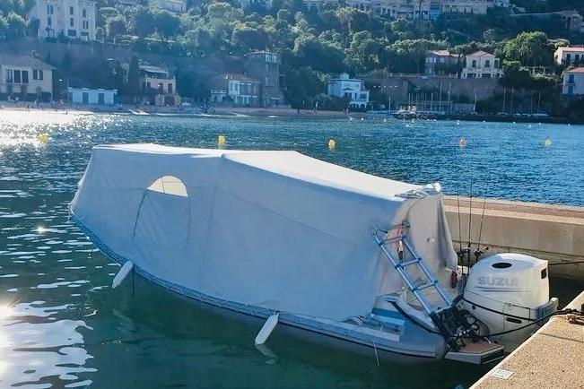 Covered Zar Formenti Zar 65 boat docked by the waterfront, 2019 model.
