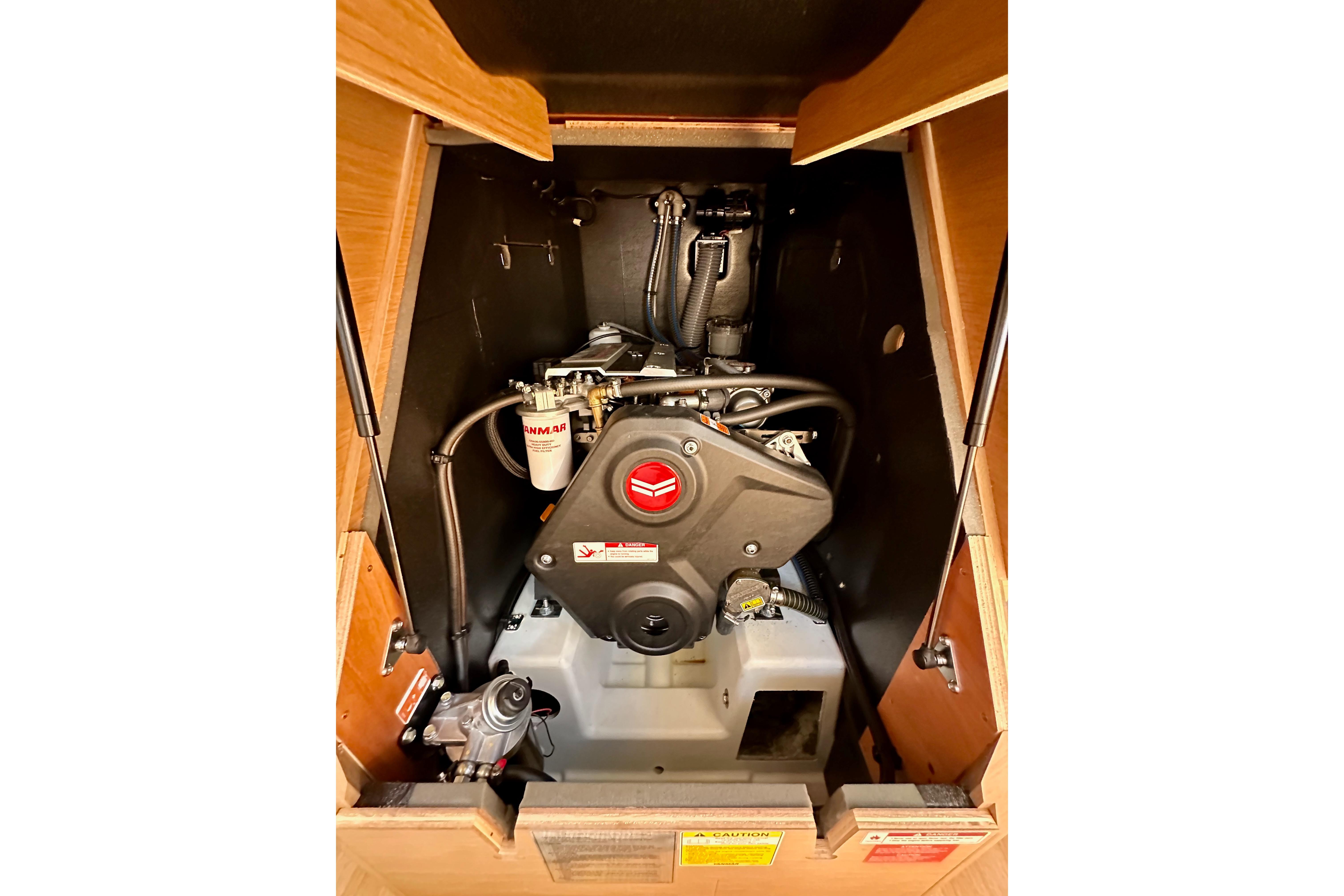 Engine compartment of 2024 Jeanneau Sun Odyssey 410 sailboat, featuring Yanmar engine.