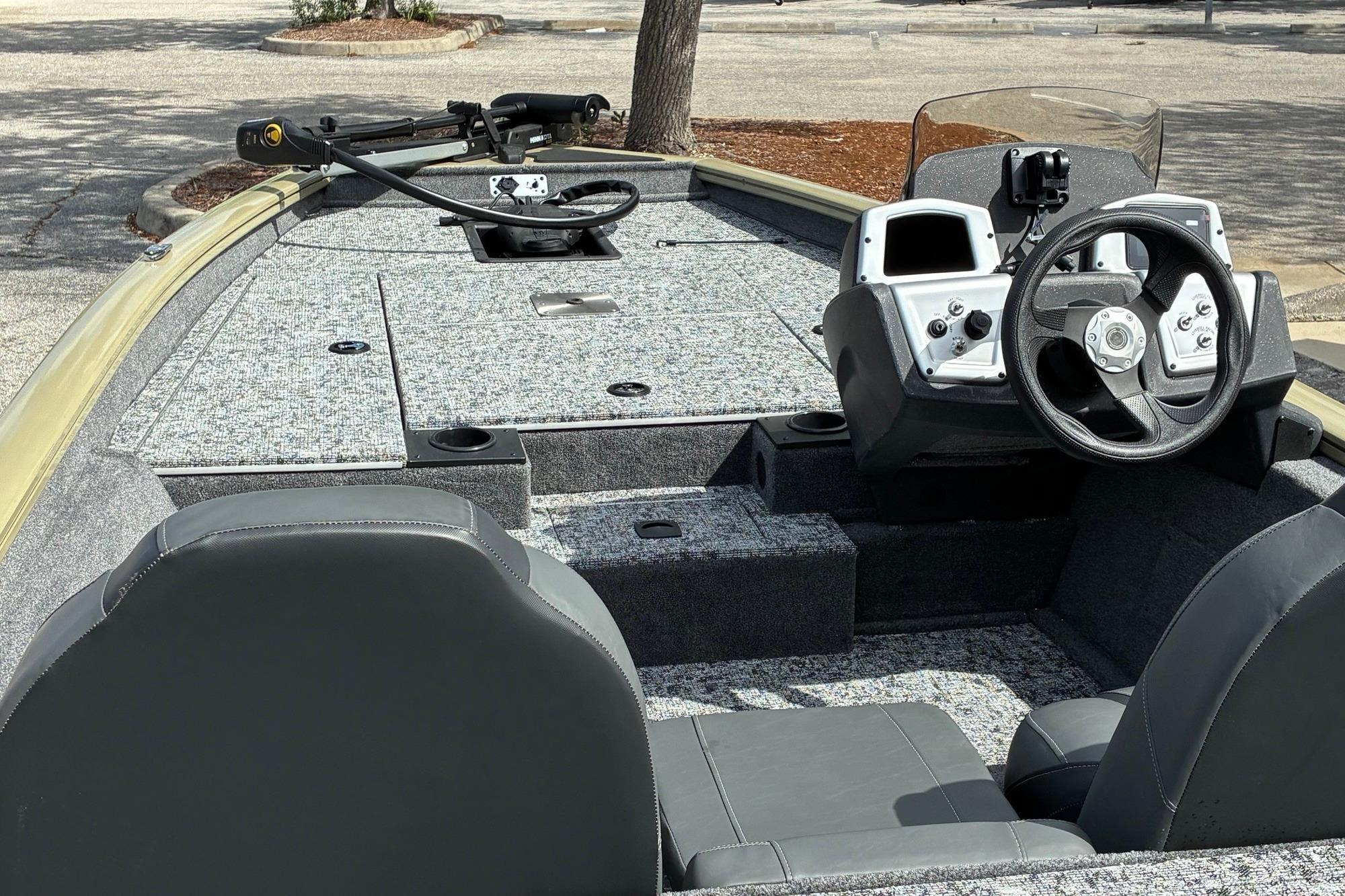 2026 Tracker Pro Team 175 boat interior with steering console and seating.