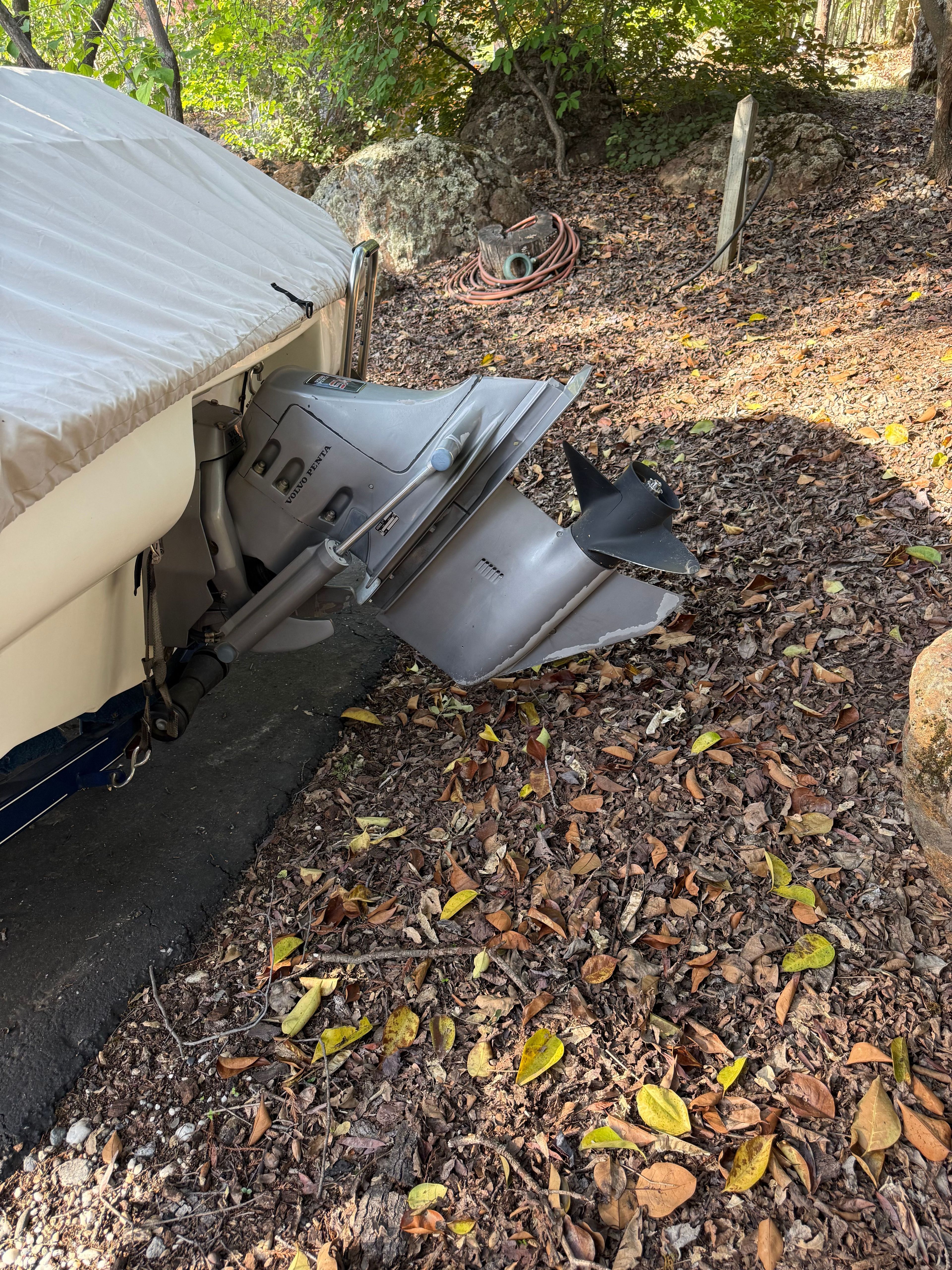 2003 Glastron SX 195 boat with cover and outboard motor.