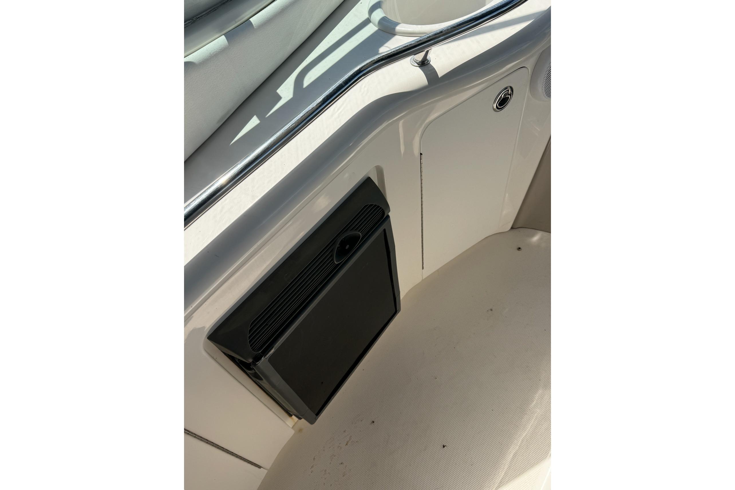 Interior detail of a 2006 Sea Ray 300 Sundancer boat, featuring a built-in speaker.