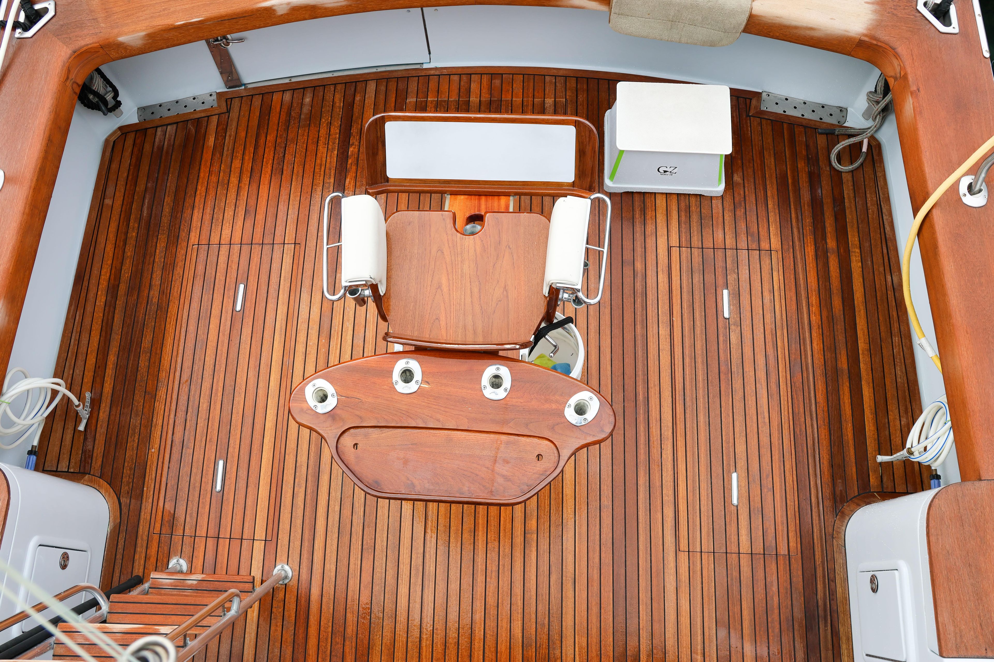 Luxurious teak deck of 2001 Black Watch 40 boat with fishing chair.